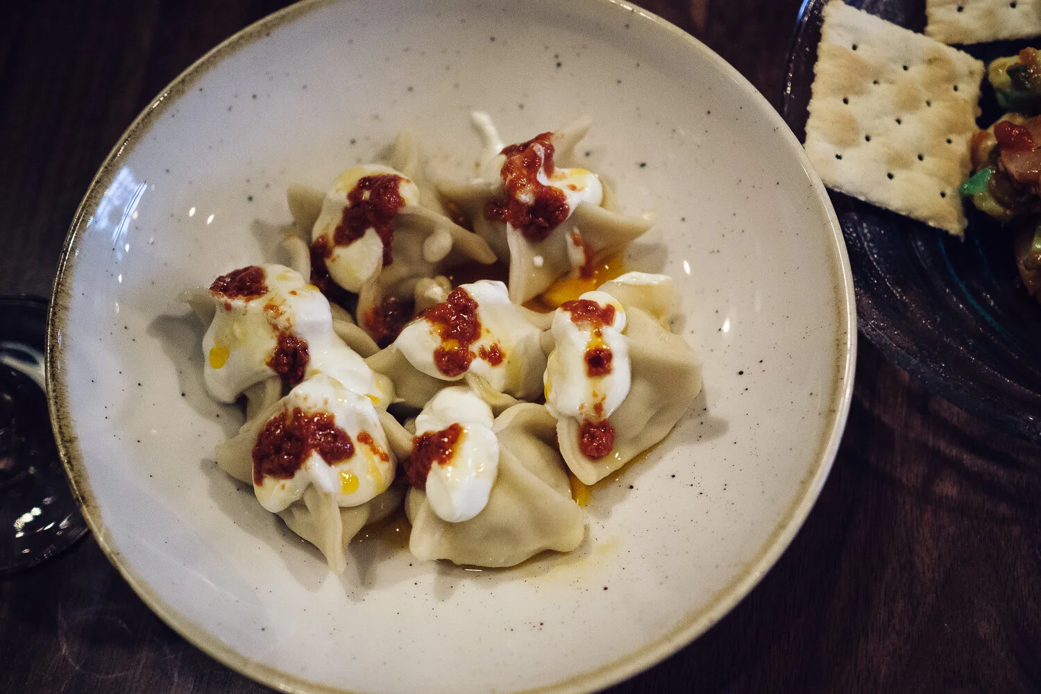 Manti (Istanbul Meat Ravioli). Garlic sour cream, red pepper butter.