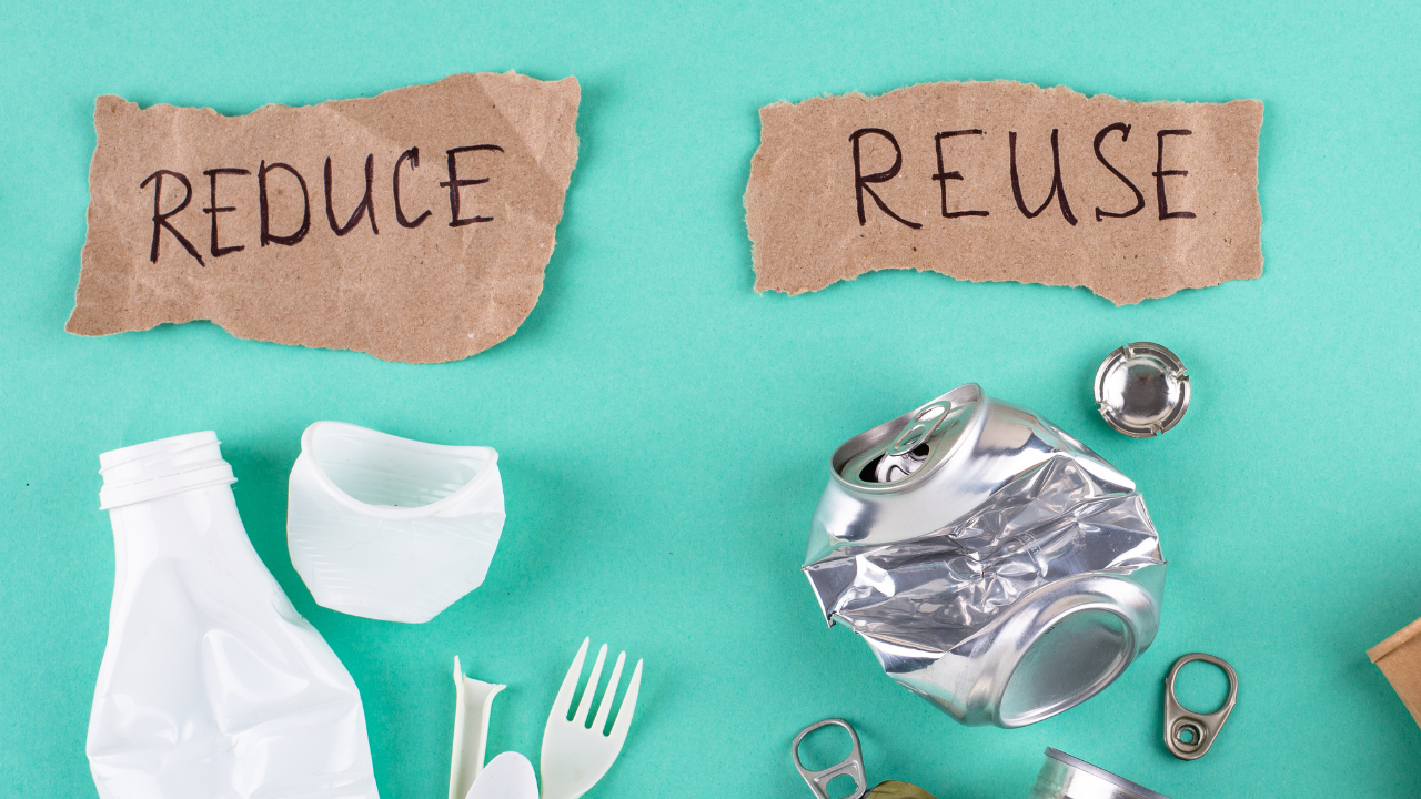 reduce and reuse written on brown paper with plastic bottles and aluminum cans