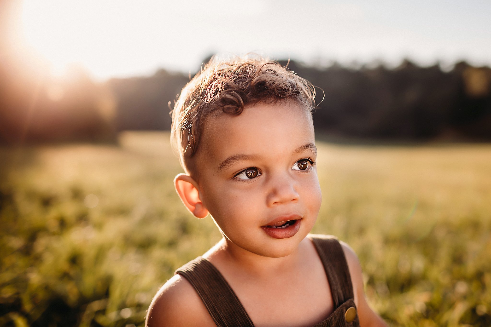 Portrait of young boy in sunlight