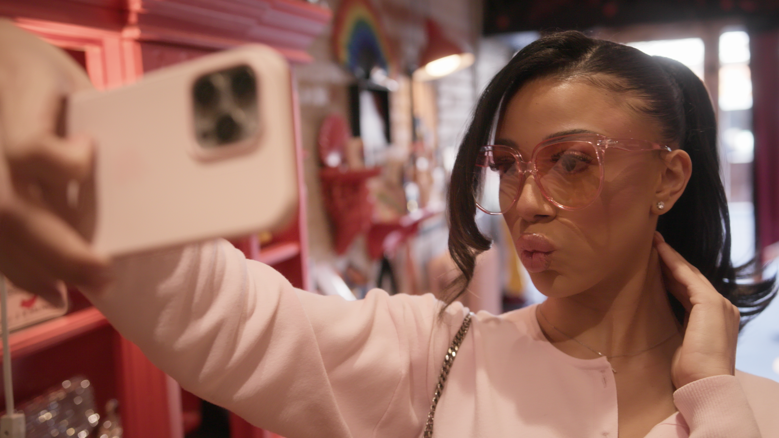 Fiona Taking Selfie With Sunglasses.png