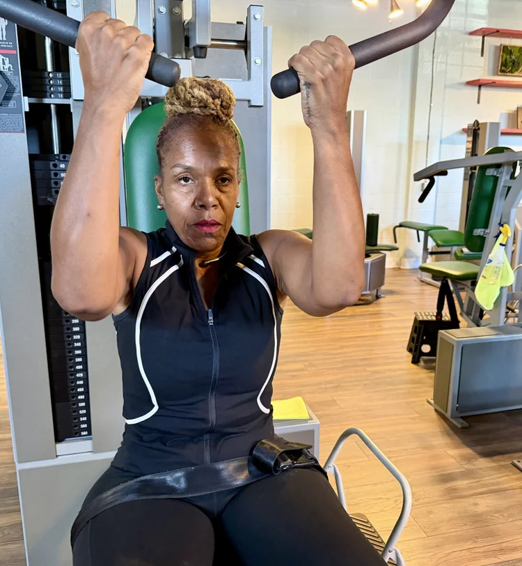 Access Strength client training on a strength machine