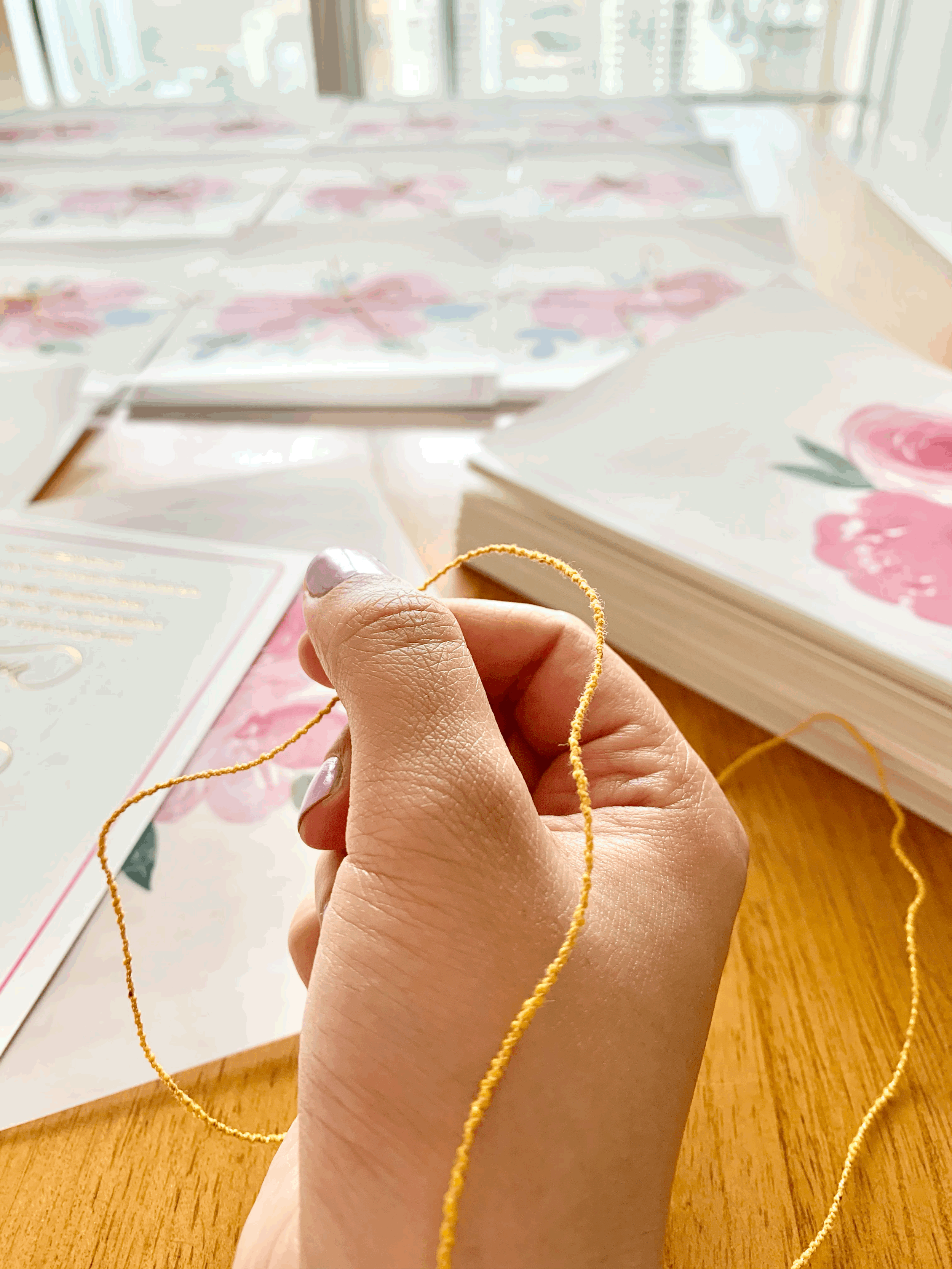 Kriti Basra crafting bespoke luxury Indian Wedding Stationery at her studio.