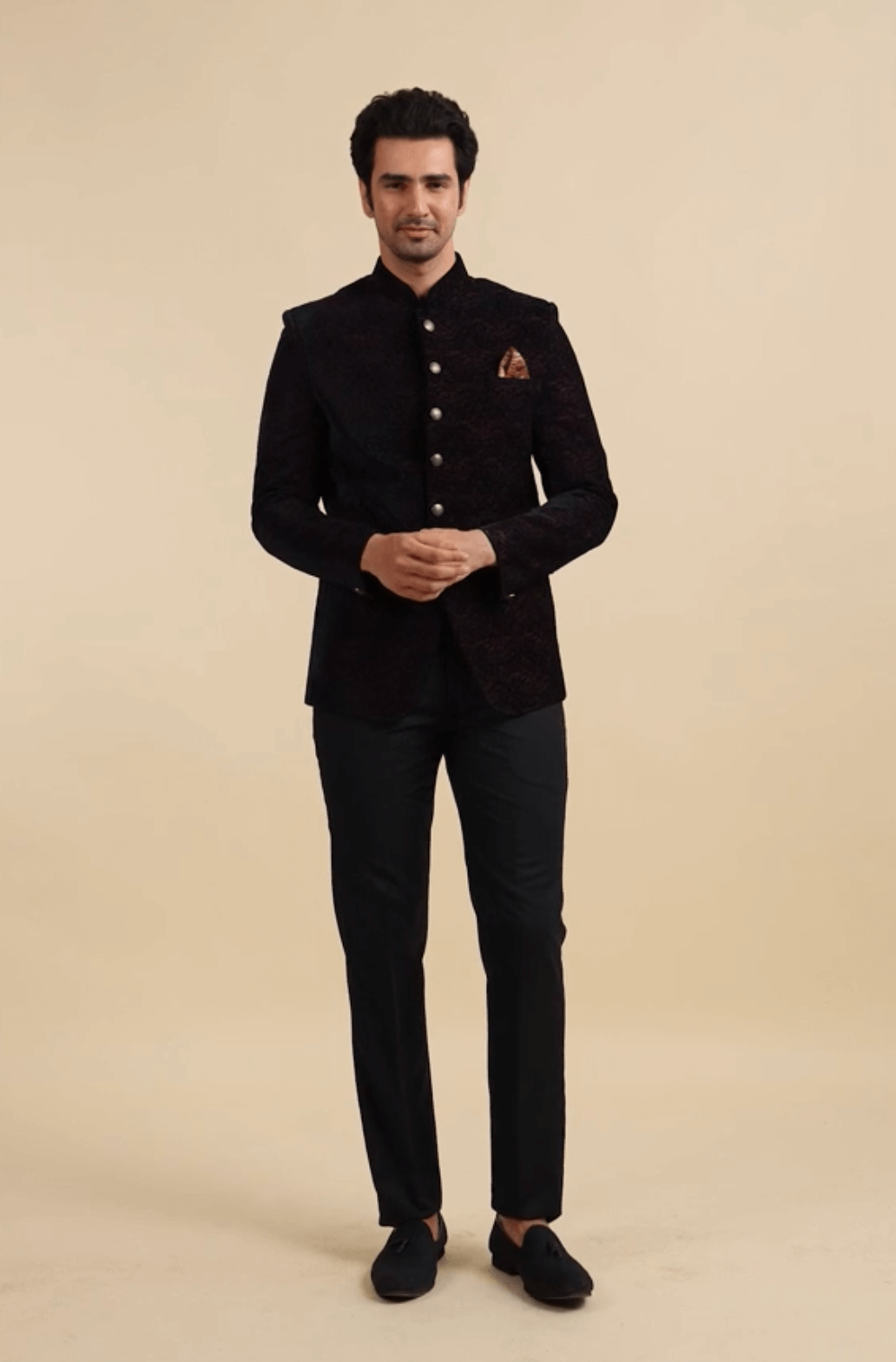 A man wearing black jodhpuri bandhgala  for fusion wedding for Americna wedding guests.