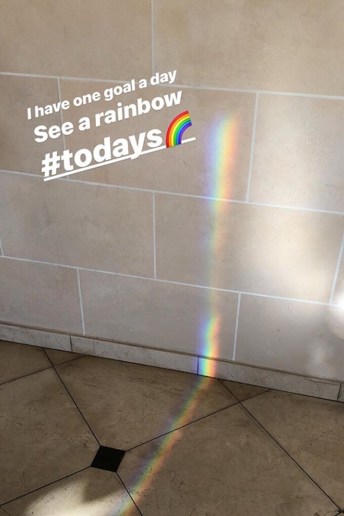 A rainbow reflection created by a glass window