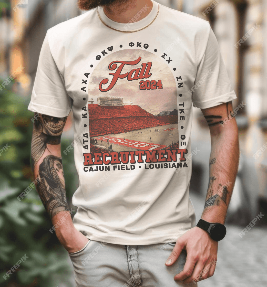 Person wearing a white T-shirt with a design promoting fall 2024 recruitment at Cajun Field in Louisiana.