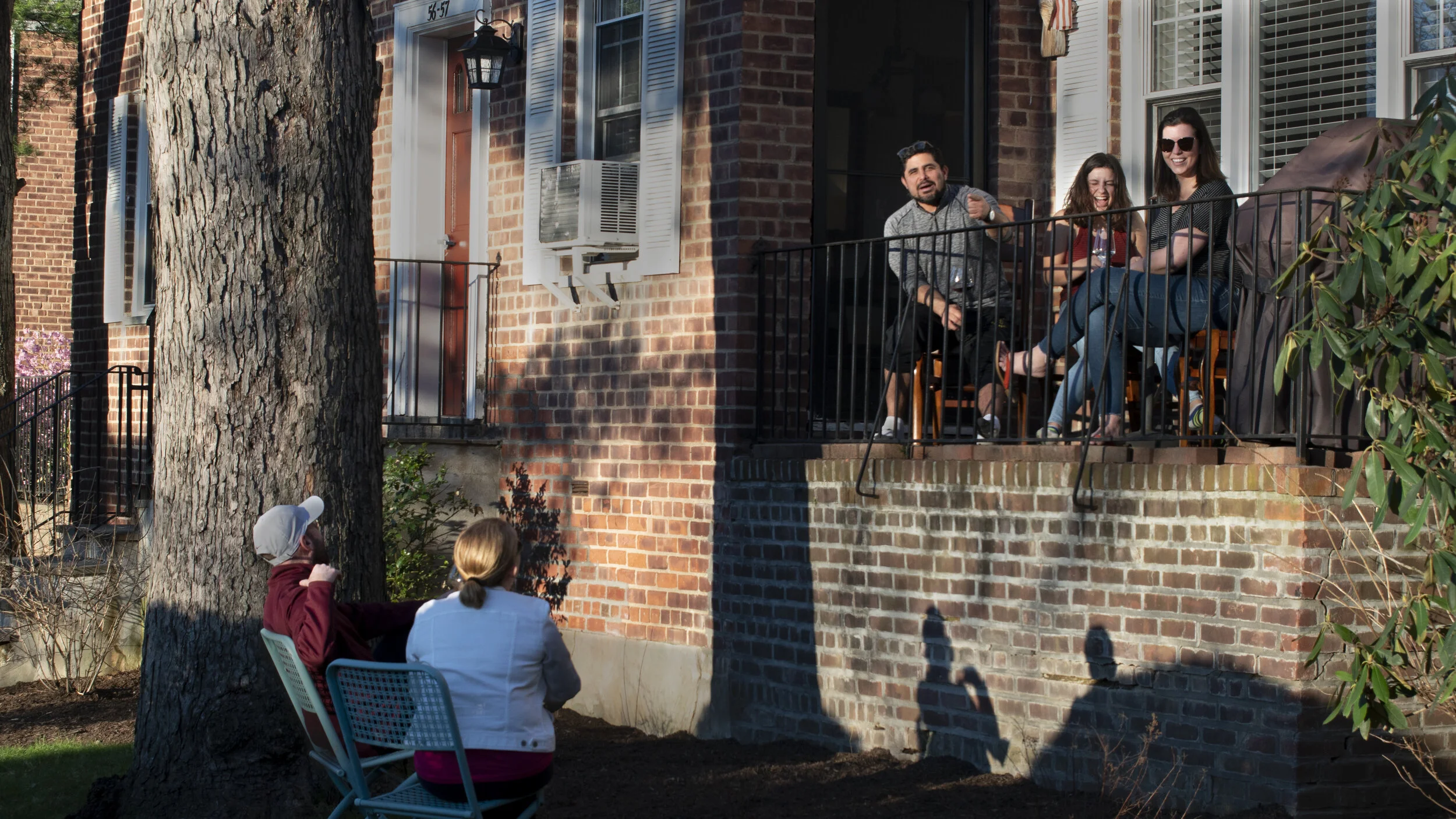 Socially distanced neighbors get together.