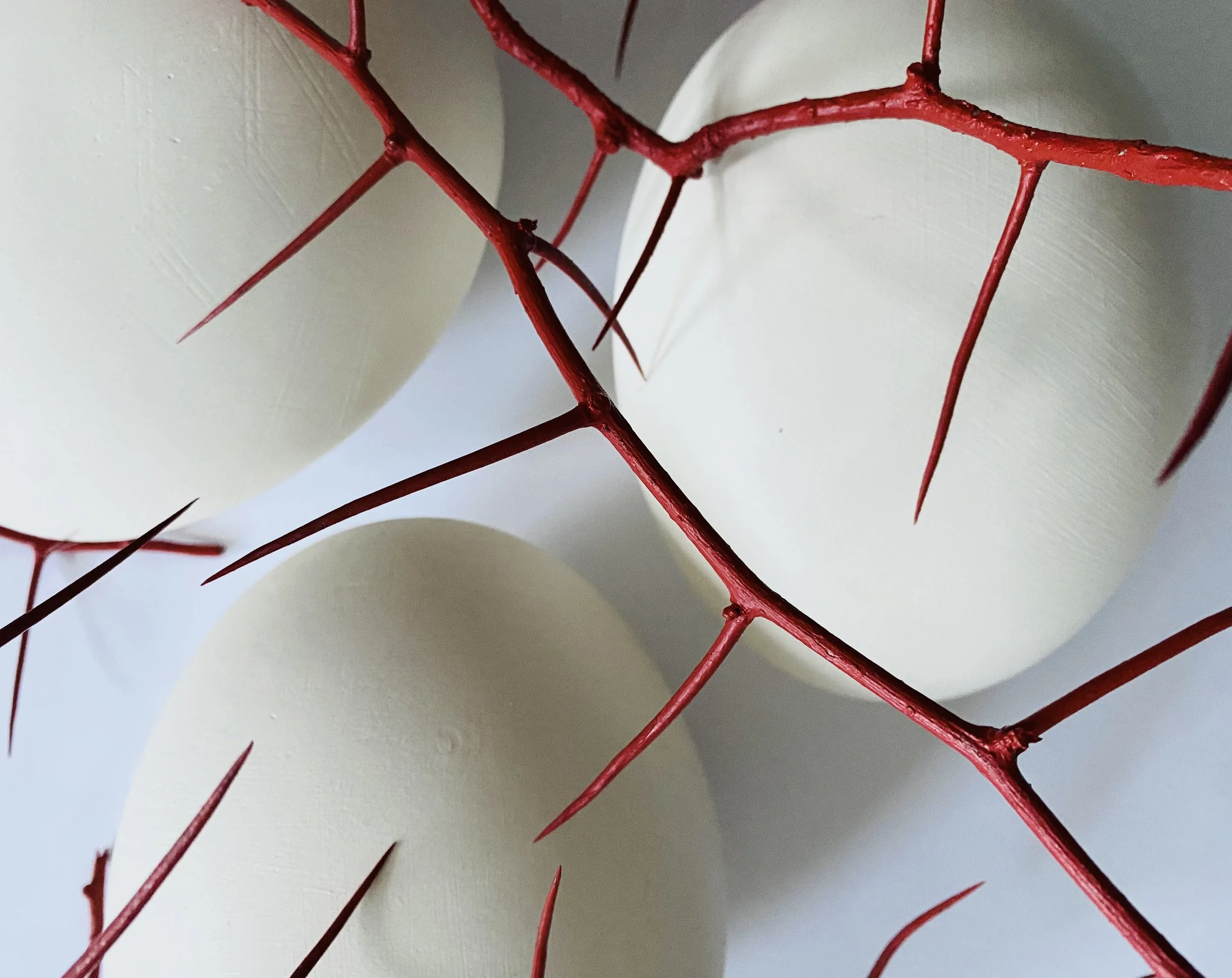 Caress of Time (installation detail), 30" x 40", stoneware, hawthorn, paint and wax, 2026