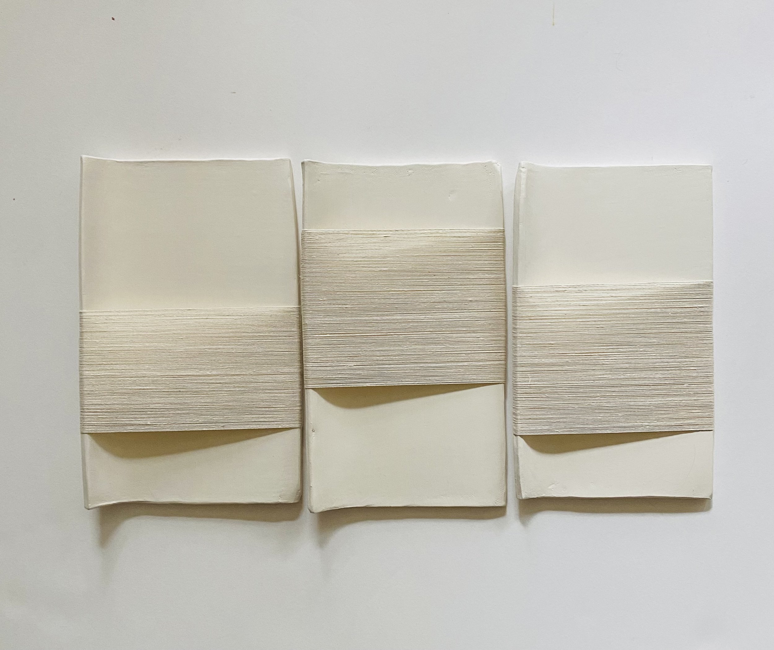 Mood Swings, 9" x 16" x 1", stoneware, paint, linen thread and wax, 2023.