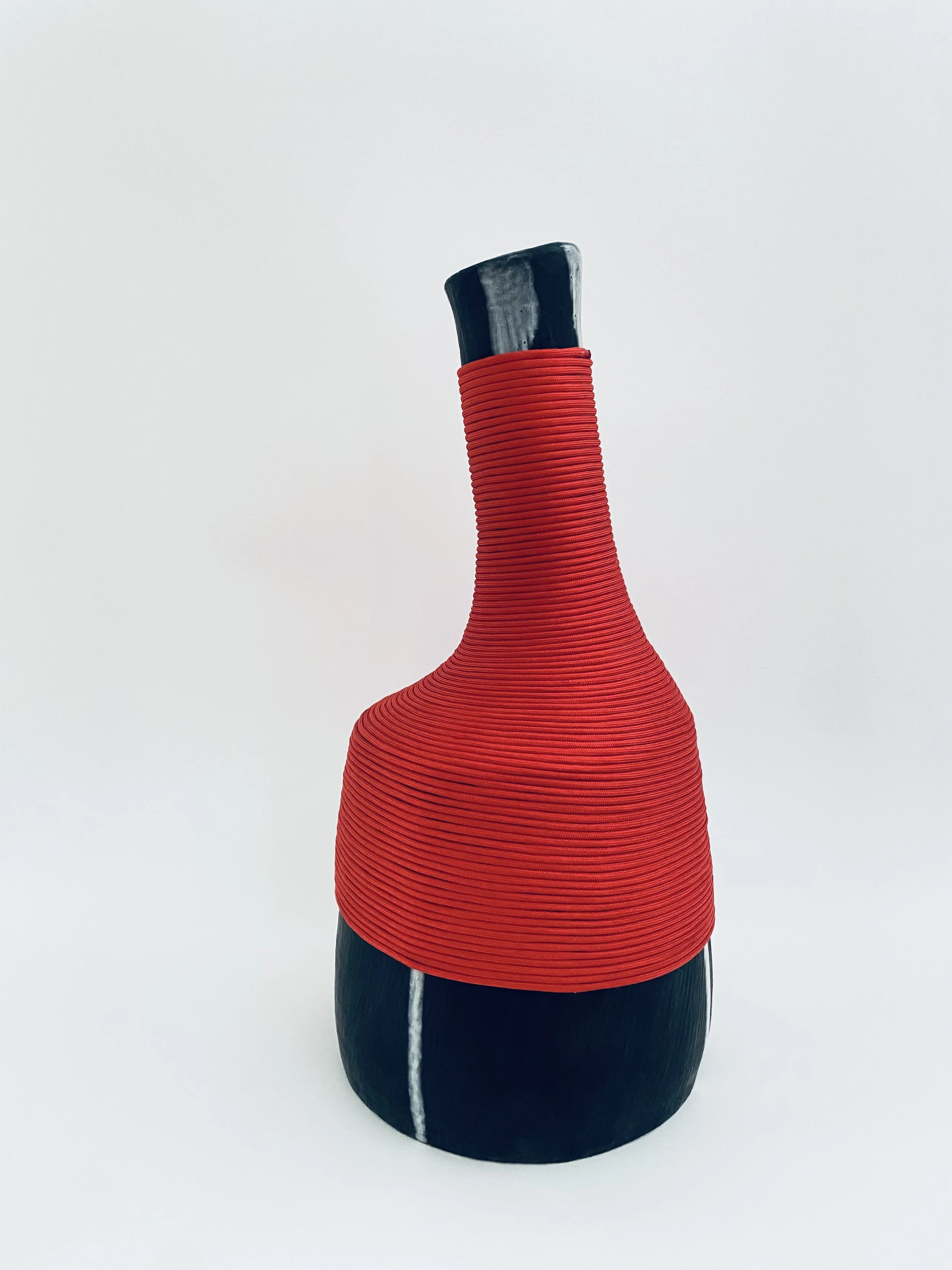 Shroud, 16" x 8" x 8", stoneware, glazes and nylon, 2025.