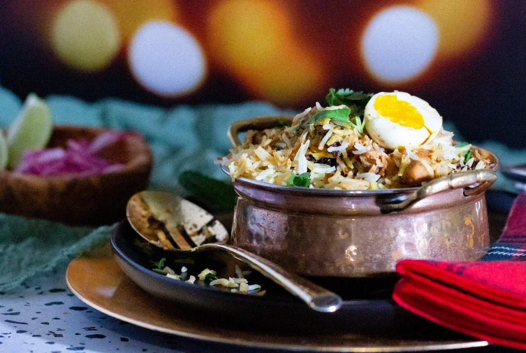 Garnish and serve with raita