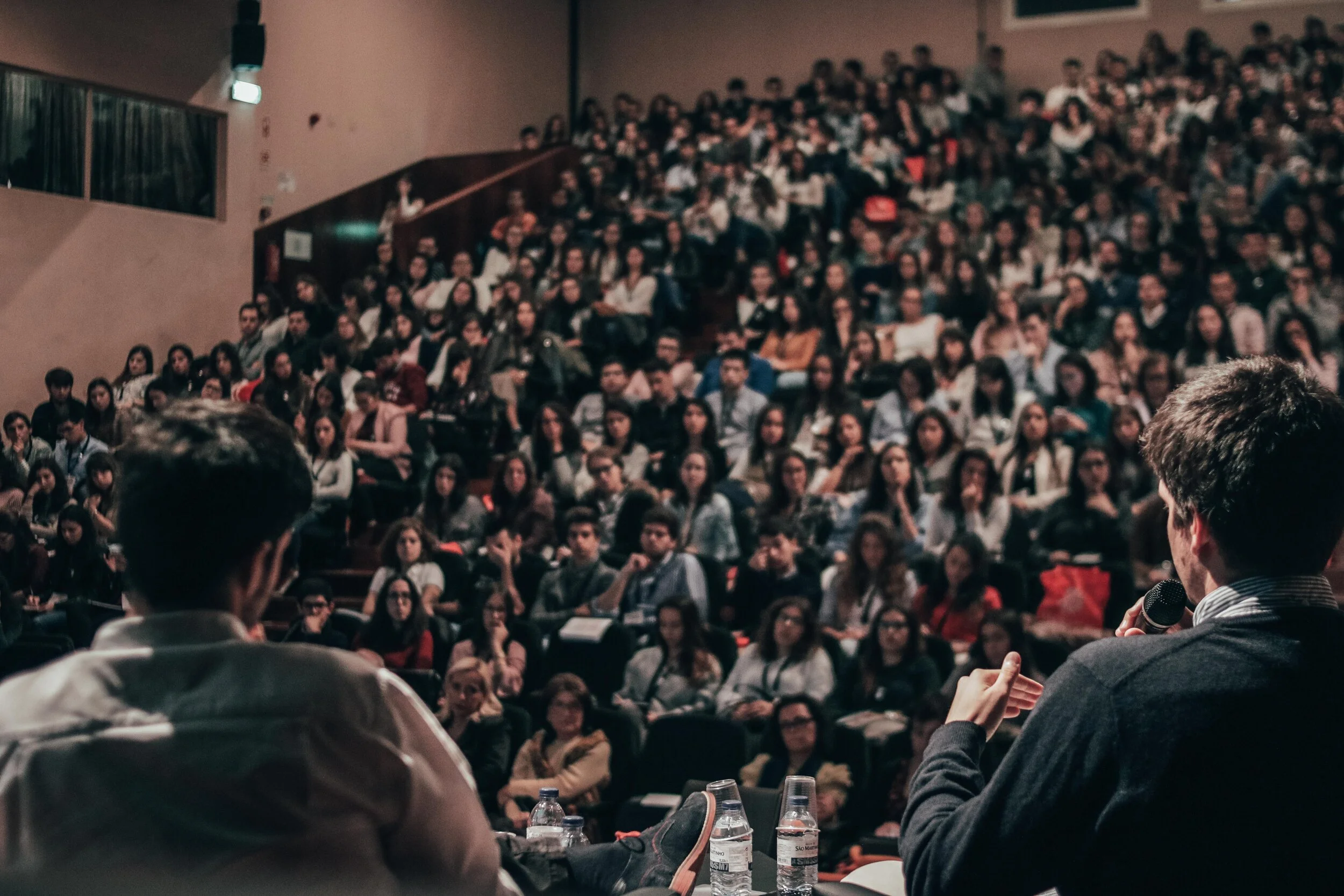 Panelists speak to an interested university crowd