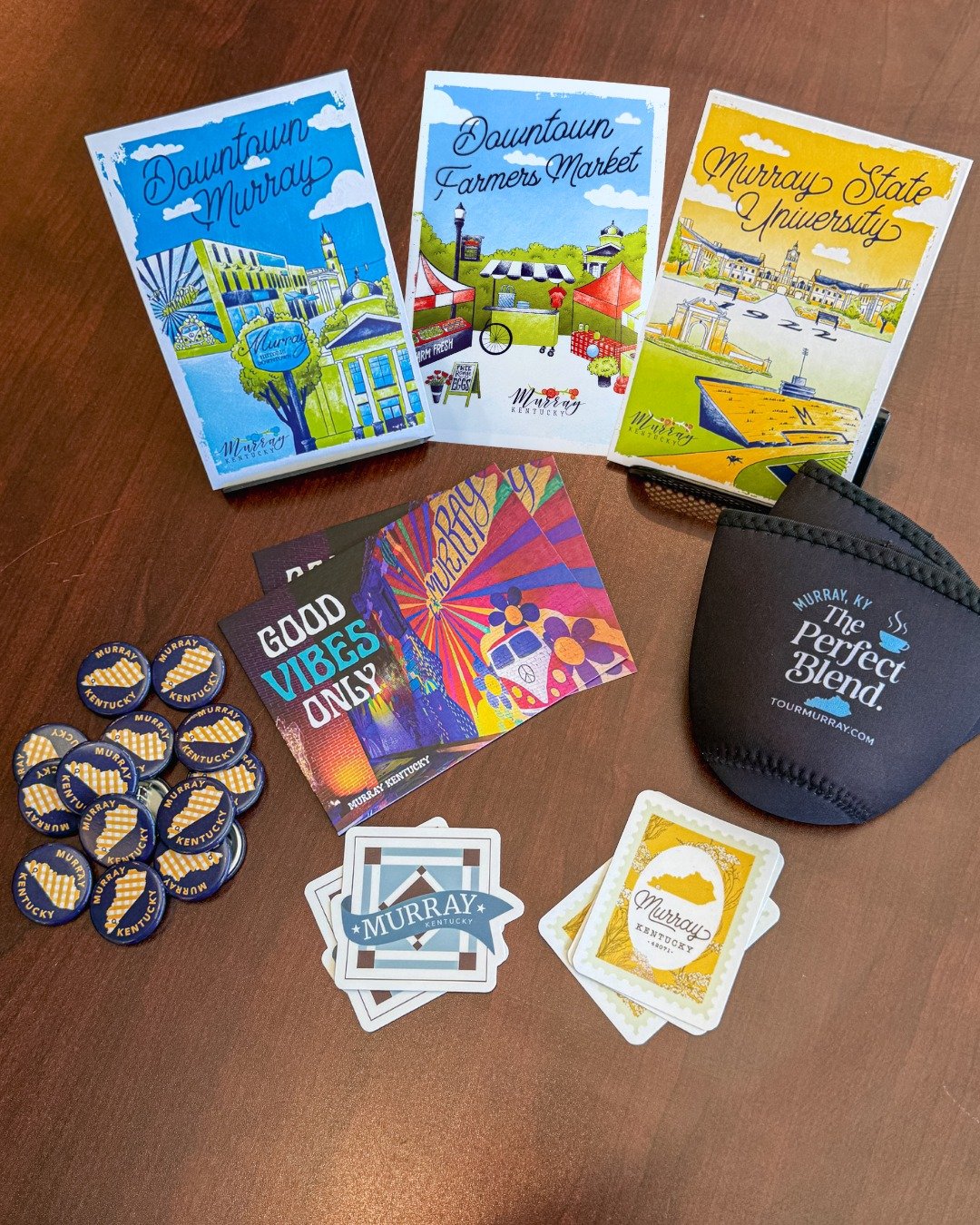 We've designed some fun new Murray-branded items recently! From postcards and buttons to stickers and koozies, we've got it all at our office in Downtown Murray. 💙