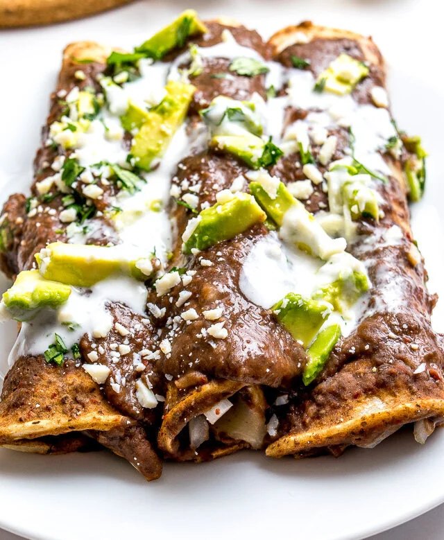 enfrijoladas-recipe-after-baking-with-garnishes-closeup.jpg