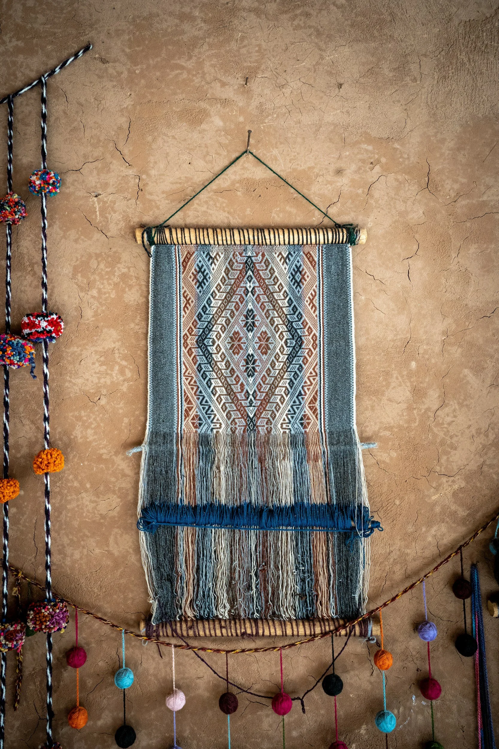 A south american embroidered wall hanging