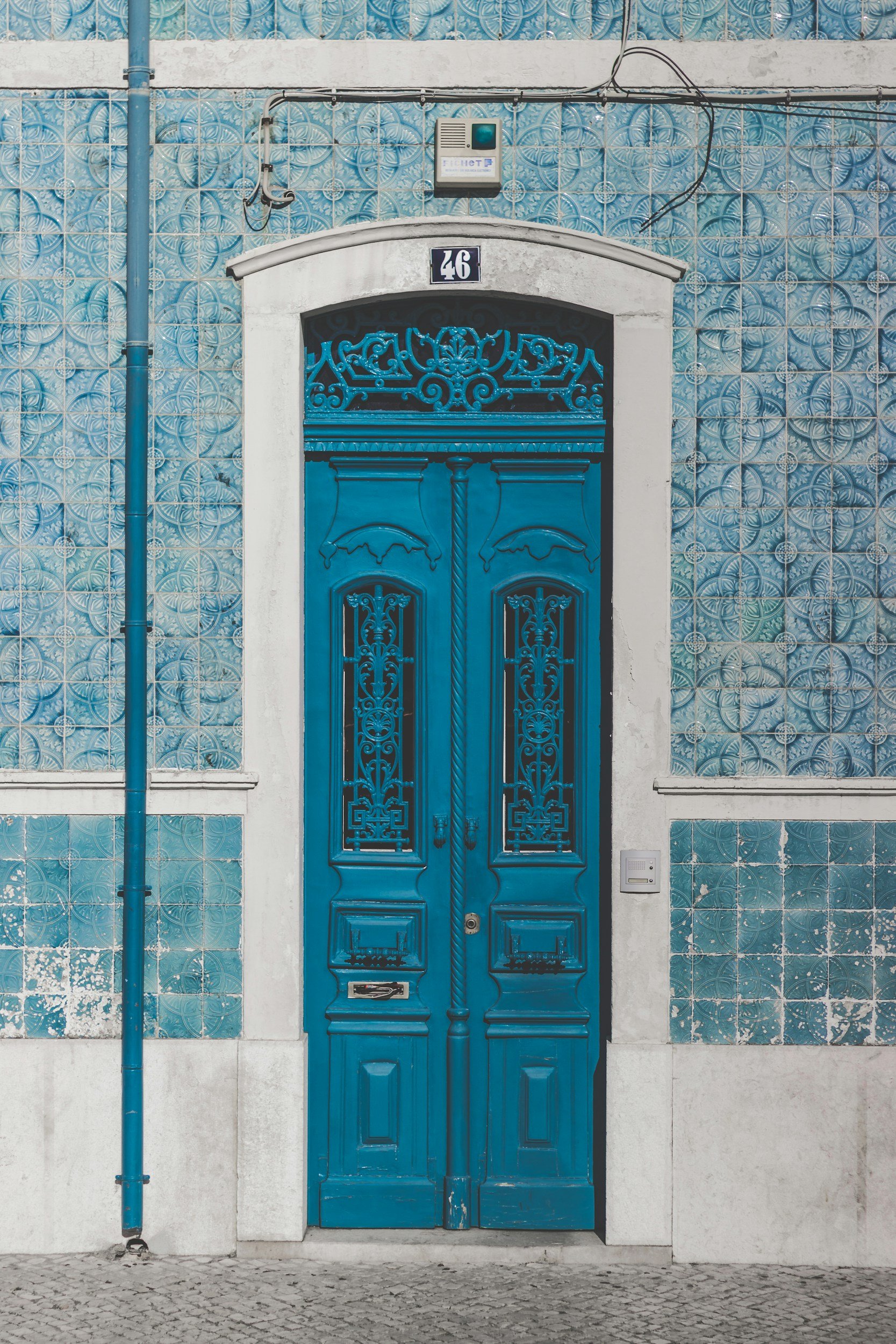 A blue door with metal work in europe