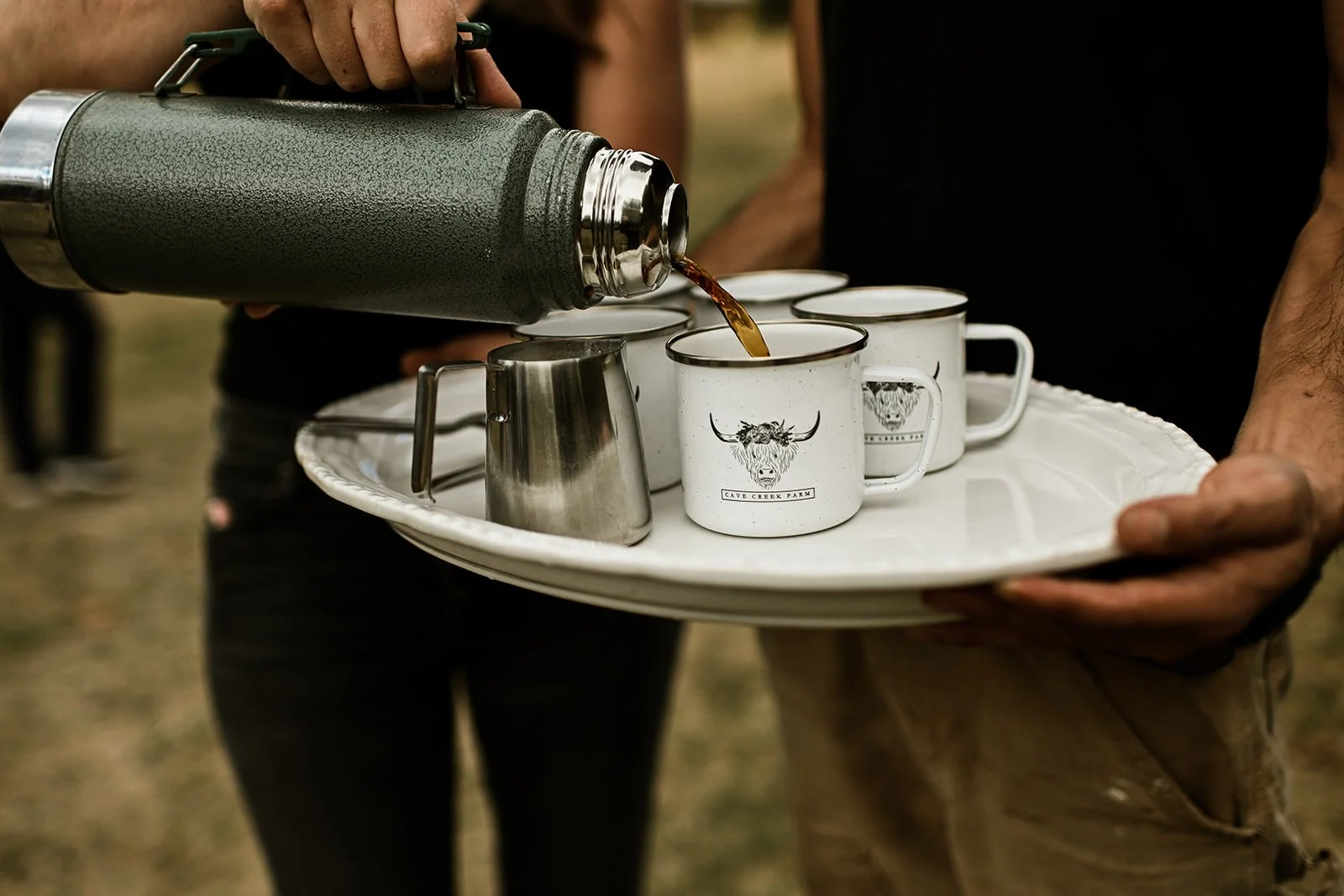 CC pouring coffee into CC mug.jpg