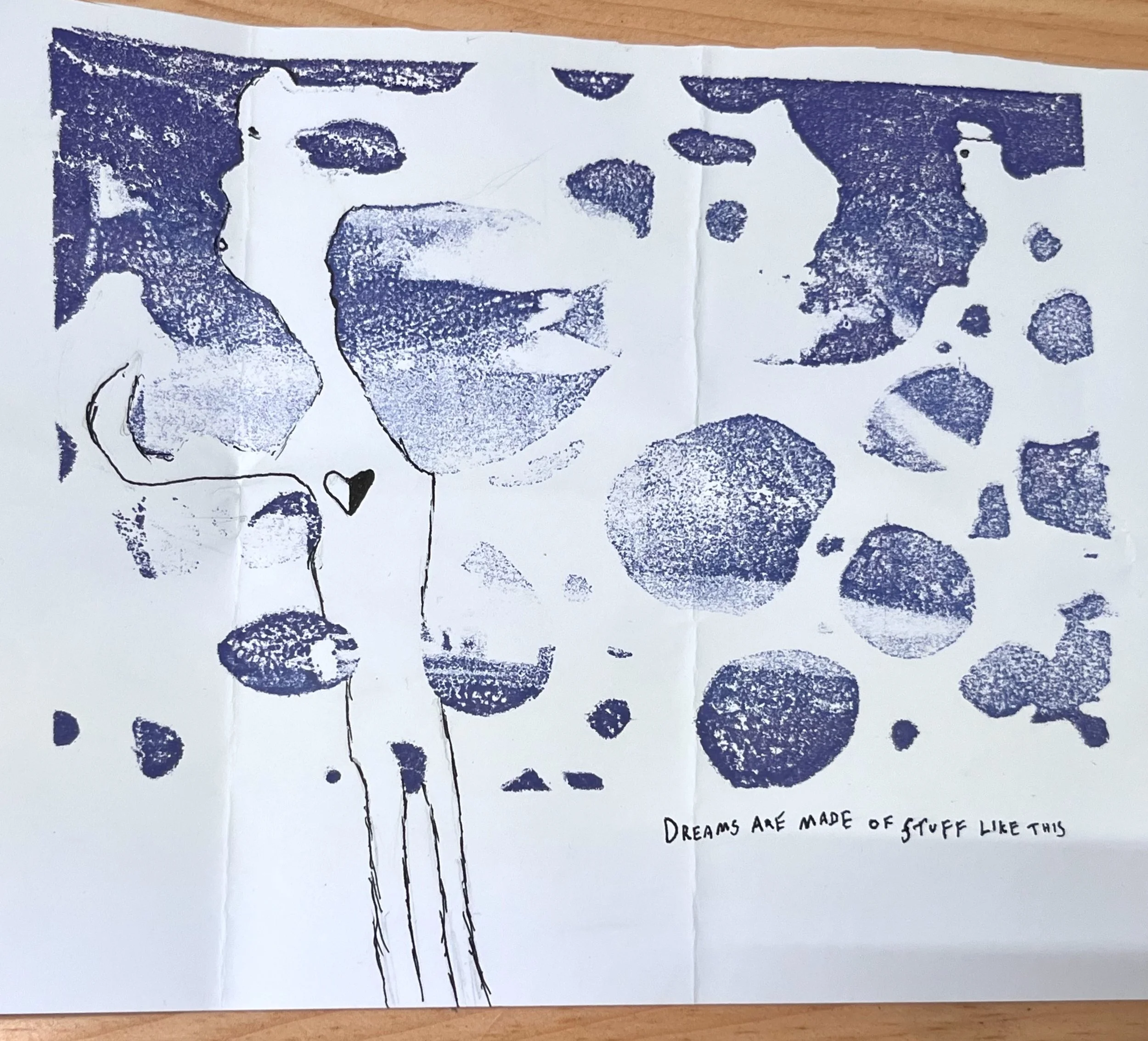 A black and white illustration of a face with a mustache and some abstract shapes surrounding it. There's a handwritten note at the bottom right that reads, 'Dreams are made of stuff like this'.