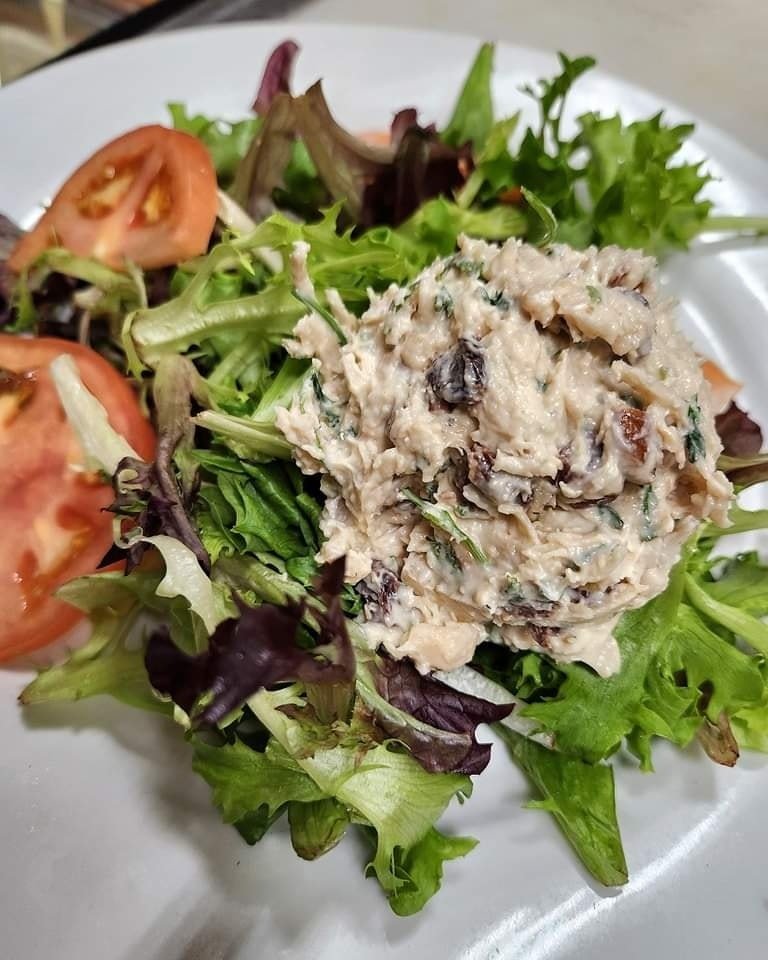 If you're looking for a lighter choice for lunch, try our homemade chicken salad. It's made with a perfect blend of apples, raisins, pecans, onions, and garlic mayo.