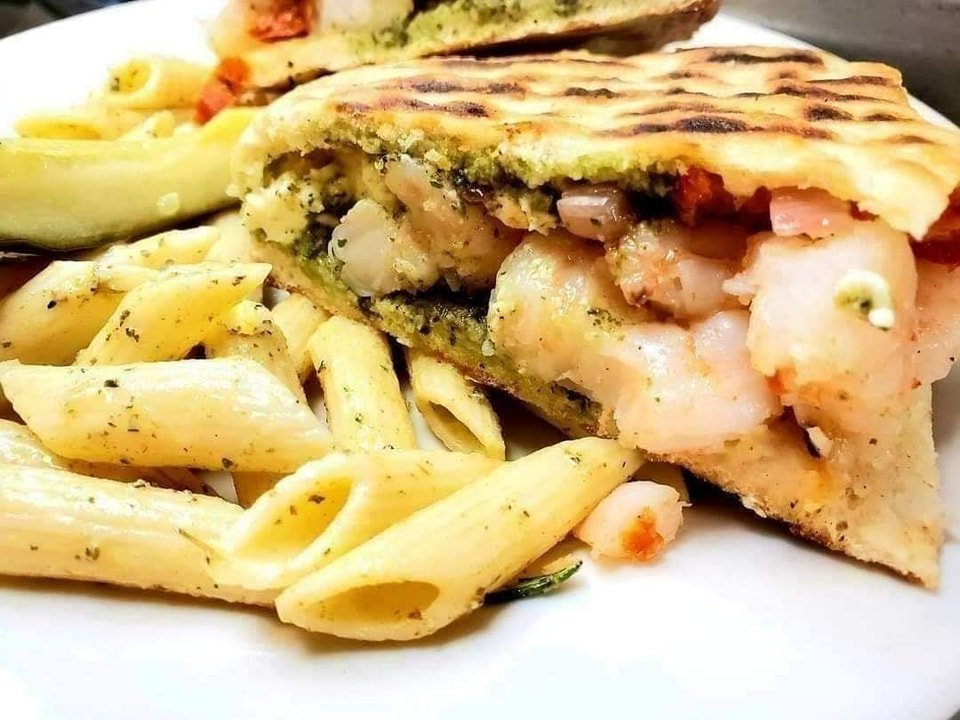 Treat yourself to our tasty Greek shrimp panini this afternoon. It's full of fresh wild-caught shrimp, feta cheese, pesto and fire roasted tomatoes. 🦐 #beaufortsc  #lunch