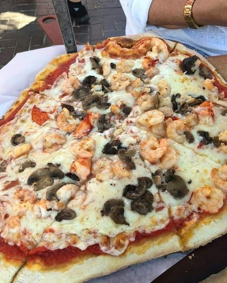 Join us for dinner and enjoy our King Neptune seafood pizza. It's topped with wild-caught shrimp, crab, mushrooms, tomato sauce, and fresh mozzarella. 🦐🦀🍕 #beaufortsc #eatlocal