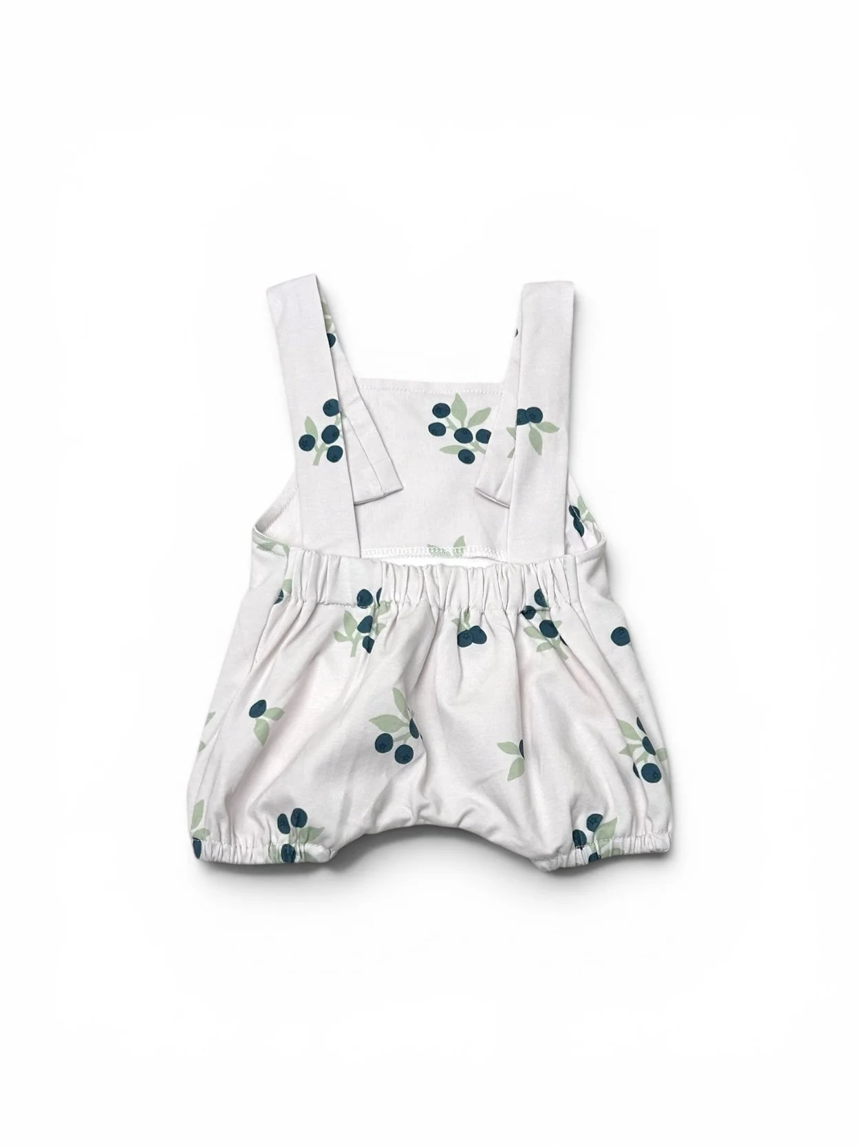 Back view of DressUpBaby blueberry baby dungaree shorts featuring adjustable cross-back straps and blueberry print.