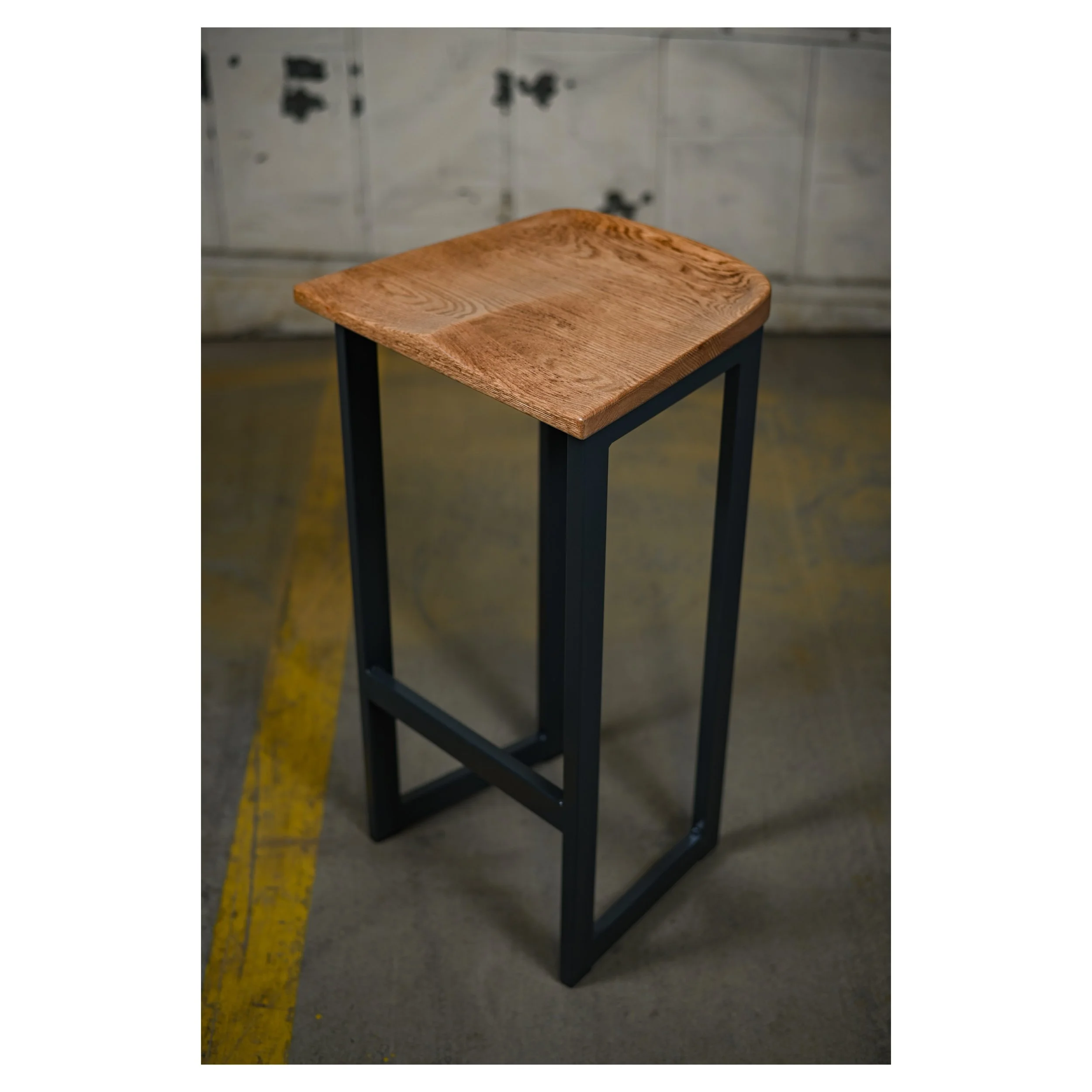 Hand carved oak barstool seat with black steel frame legs 