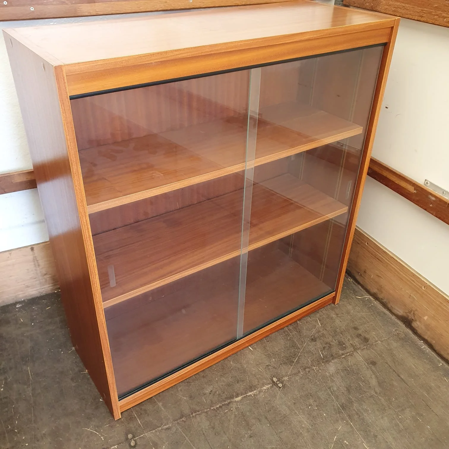 £100 - glass  sliding door  bookcase  - 90cm wide 35cm deep 99cm high