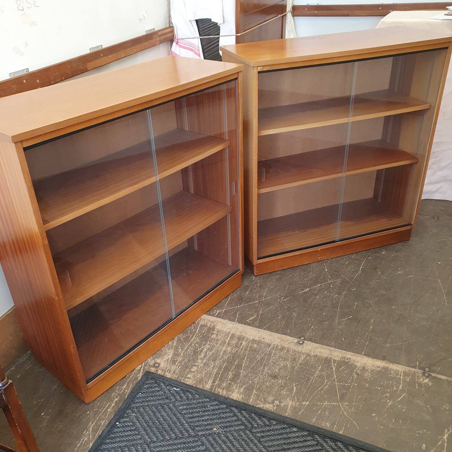 £100 each -  2 glass door sliding bookcases  -92cm wide 38cm deep 101 cm high