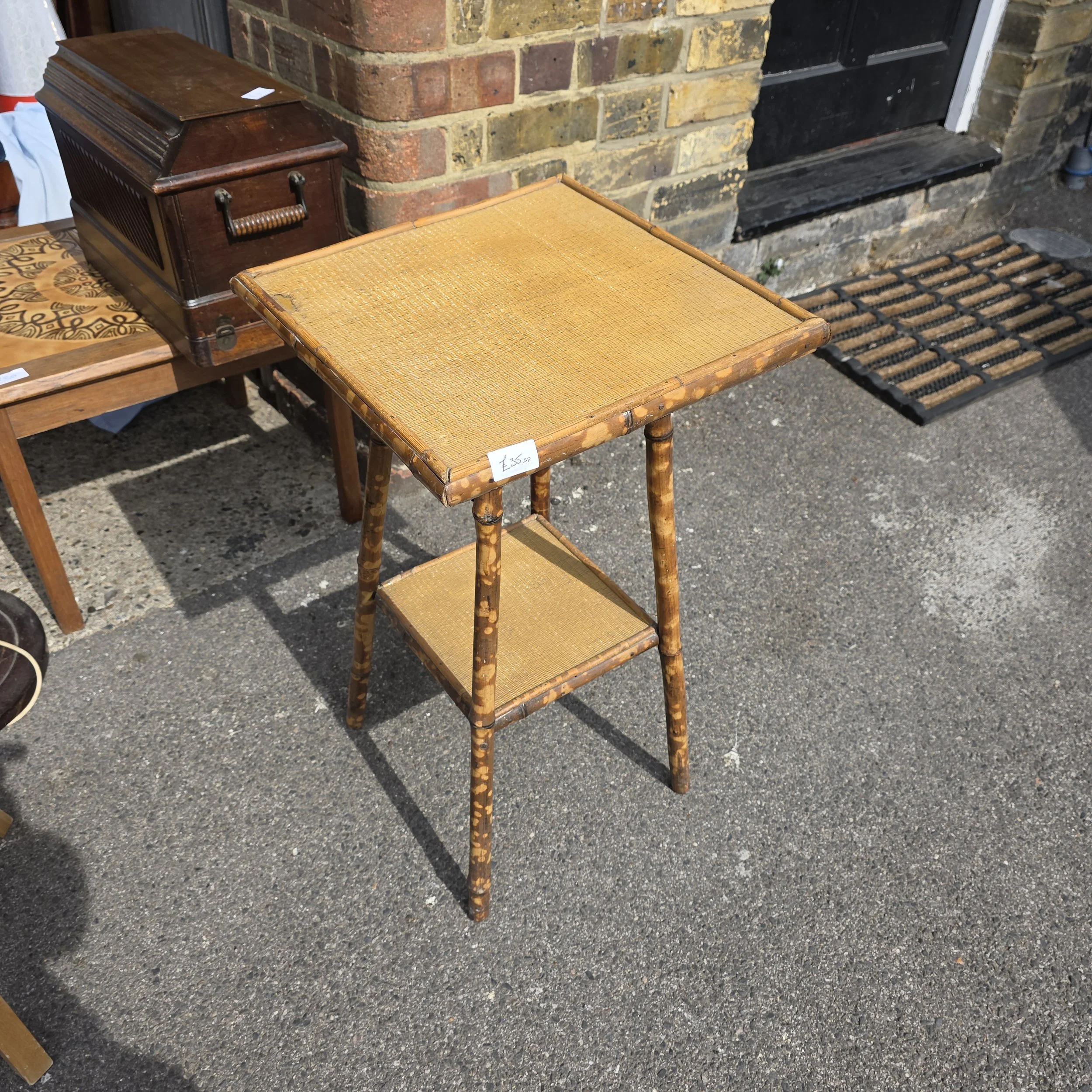 £35 - bamboo table - 38cm across 66cm high -  small fault