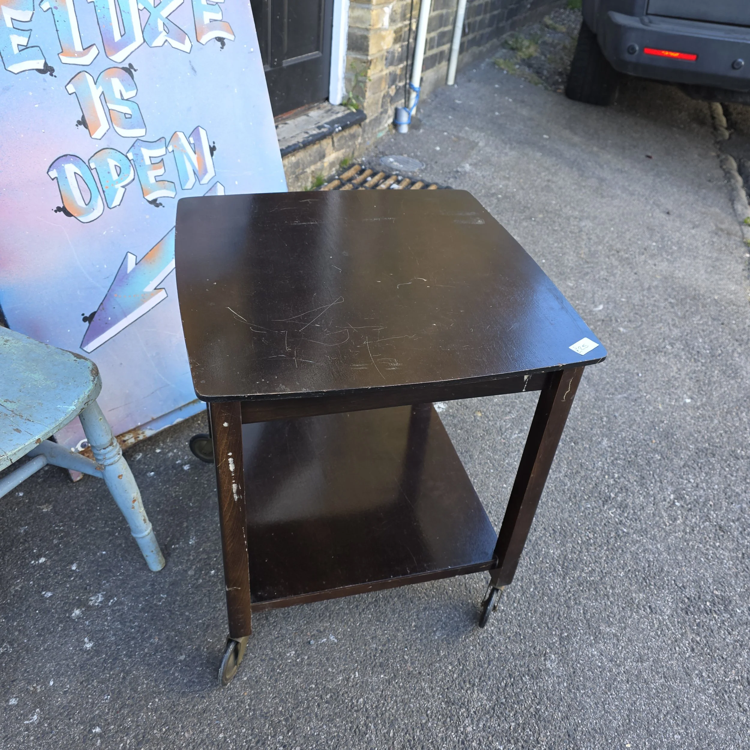 £25 - table on casters  - 53cm square  59cm high