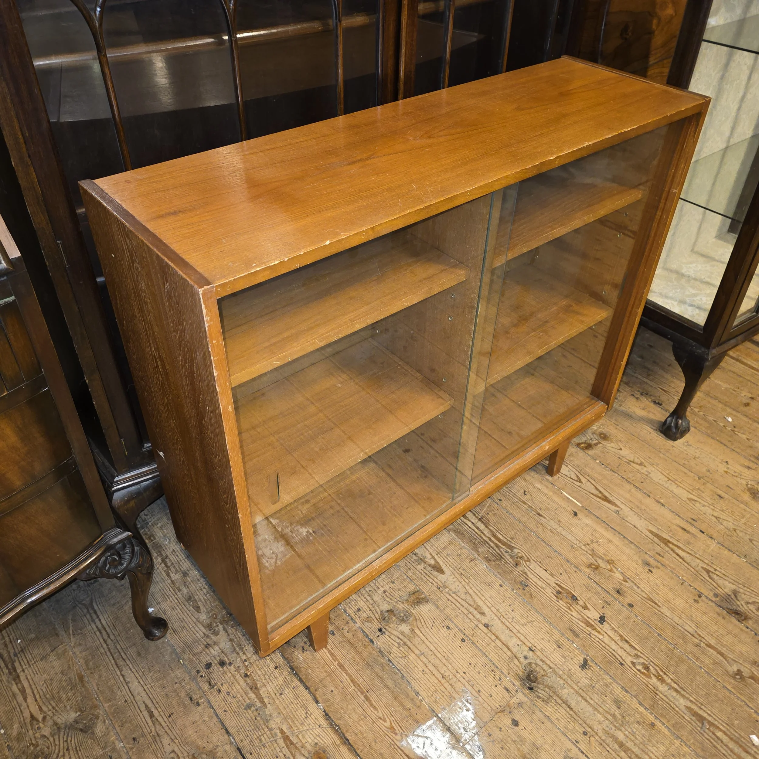 £85 - teak sliding door bookcase - 91cm wide 29cm deep 83cm high