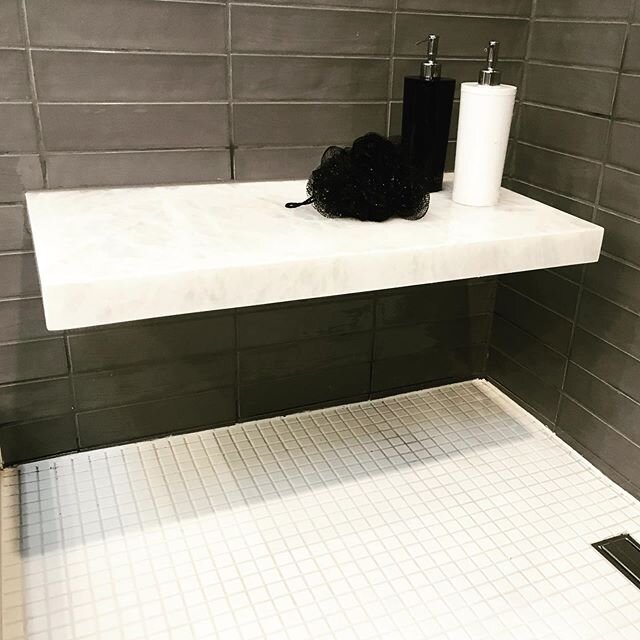 This sweet cantilevered shower bench made good use of the very last of our oversized iceberg white quartzite slab. The steam shower is ready. 🖤🖤🖤 #icebergwhite 
#steamshower
#chicagointeriordesigner 
@thefinelinechi 
@pamela.olafsson.interiors