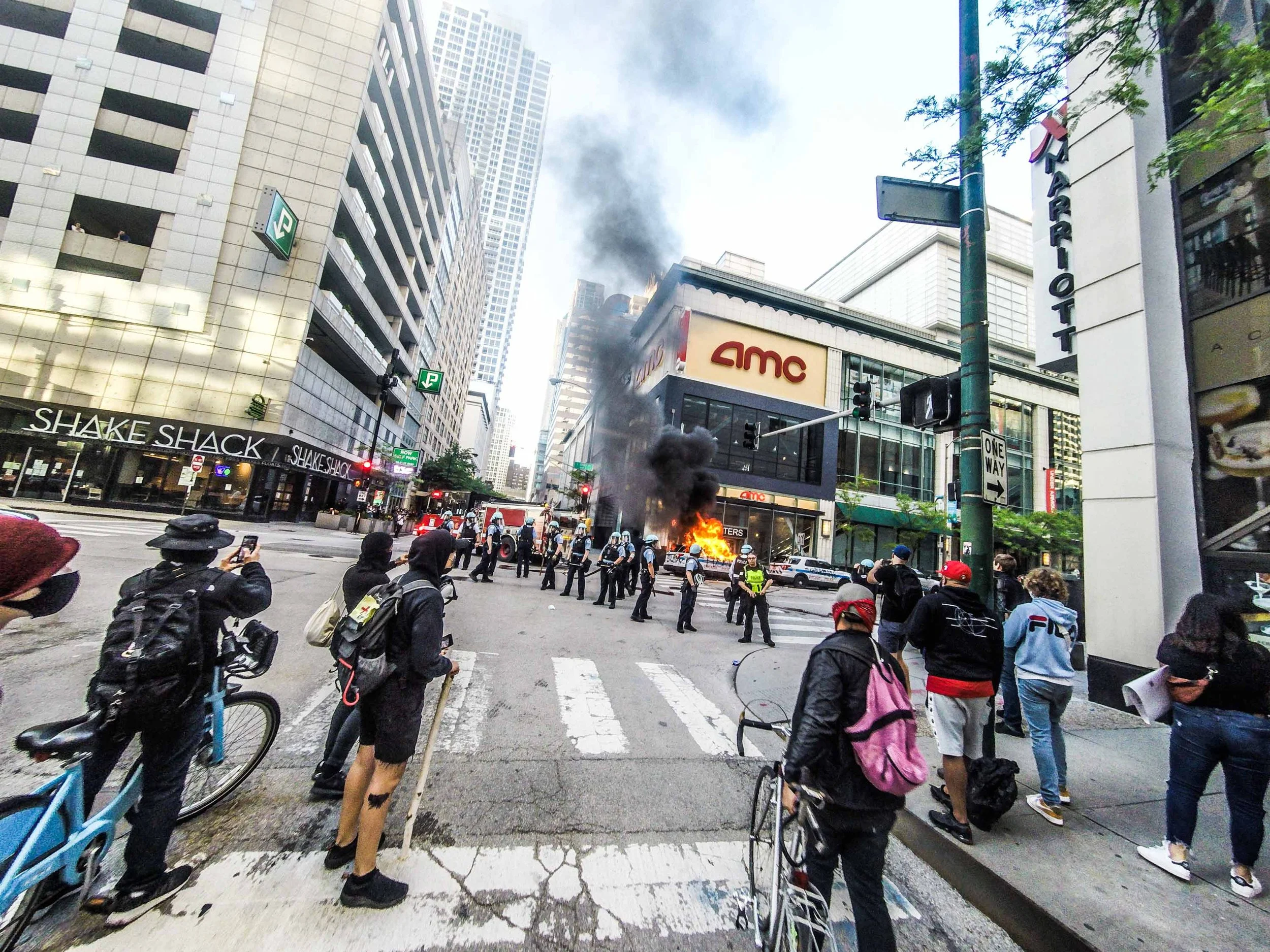 I rolled to the front line of protesters to watch the cops take it on the chin all while sipping Jack Daniels. To my bewilderment I watched a cop get his ass kicked. Punched and kicked before he could get back to the safety of other officers. That wa