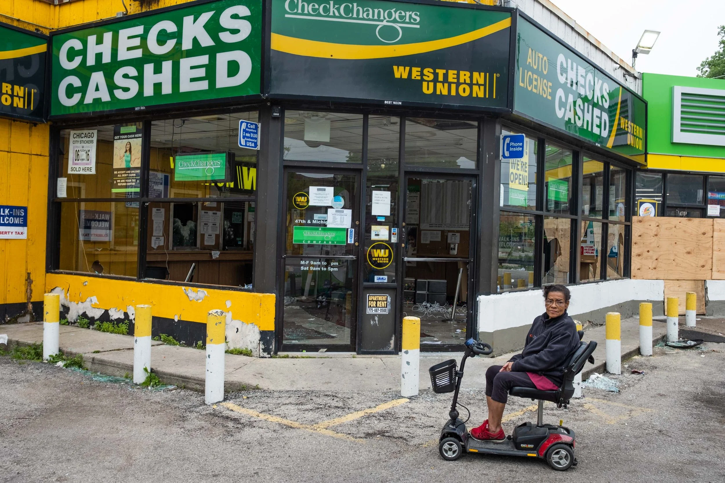 That Monday morning the sun did manage to rise over lake Michigan. And when it did, I found myself taking a photo of a poor little grandma named Karen in front of her Currency exchange. She was just sitting in her electric wheelchair staring at the e