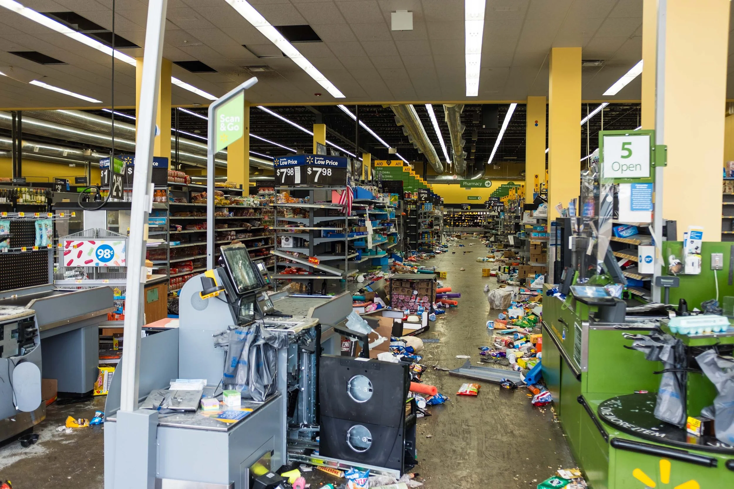 Over at Western and North a couple of blocks from where I used to live I found an Auto Zone that was being emptied out, and a Walgreens with its alarm blaring and looters running in and out tripping over the busted metal awnings. Supposedly the drugs