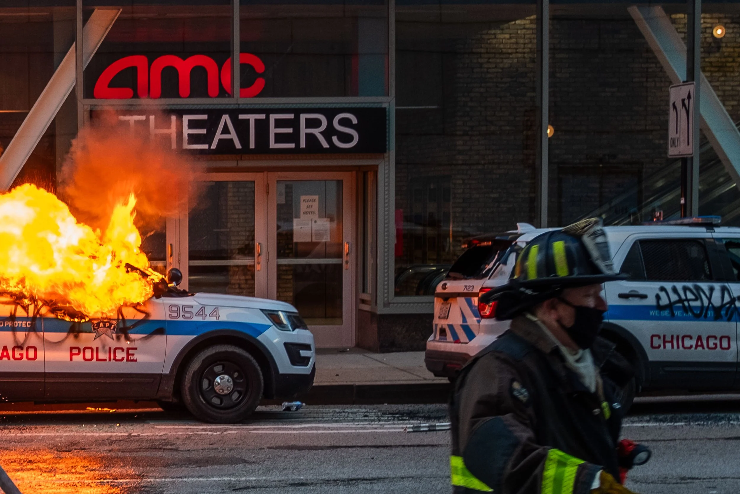 Never in my life did I expect to see a Chicago police car on fire. The Ford SUV cop car was burning in front of the AMC theater and then it exploded. Except the explosion was kinda pathetic. But still my primal stem in the back of my head was gleeful