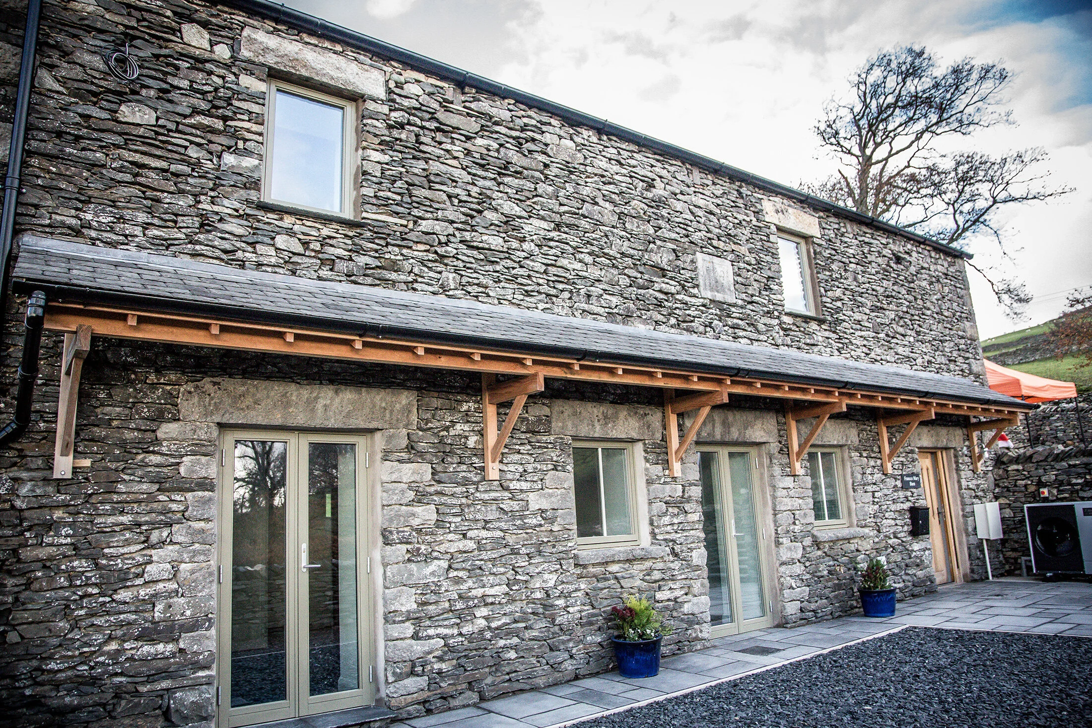 Stone barn conversion into a row of terraced cottages