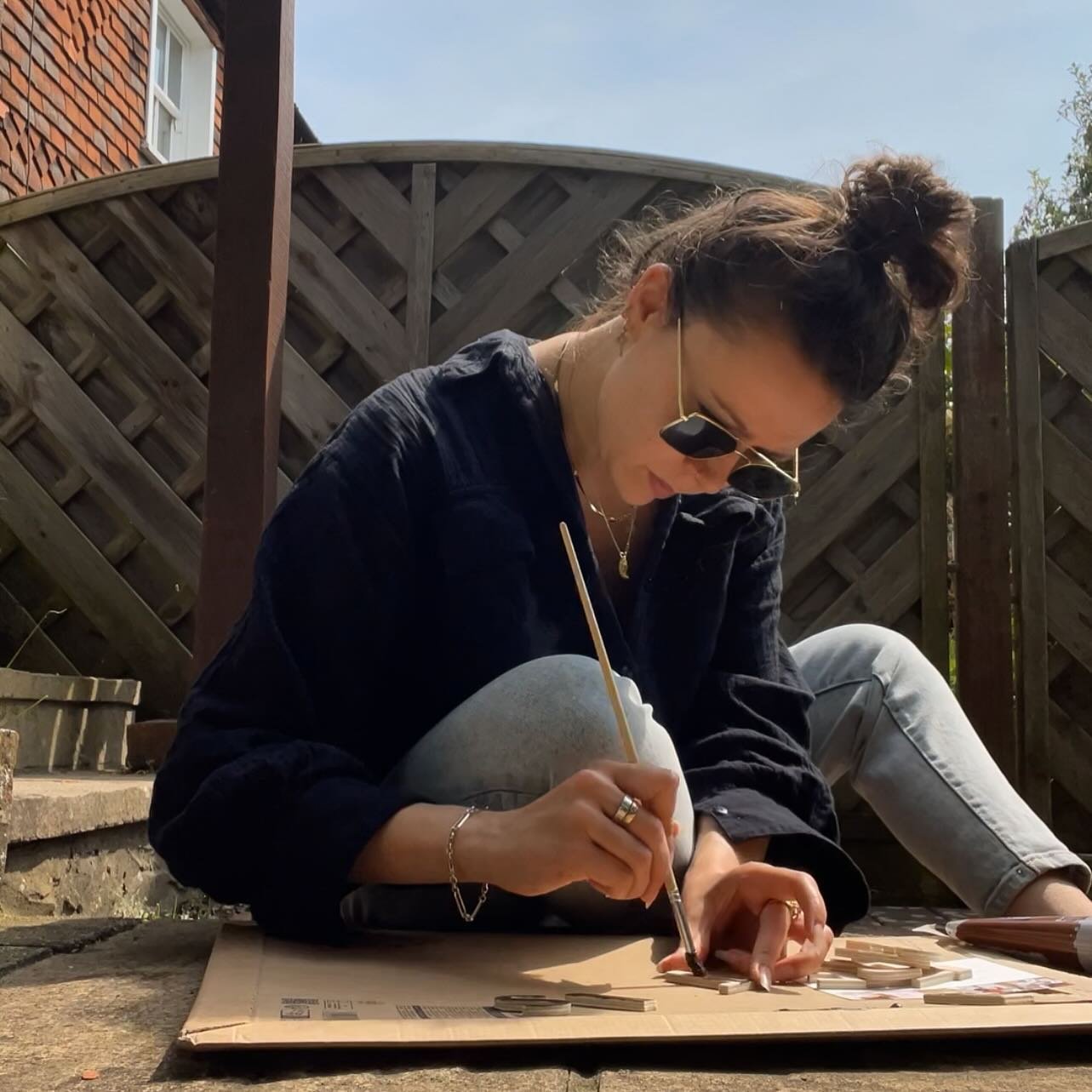 Trying to break up the desk work as I finish off the final collections for my upcoming show and I&rsquo;m taking whatever I can outdoors 🌱

From finishing up sketches or here with a very serious concentration face painting up the letters for my bran