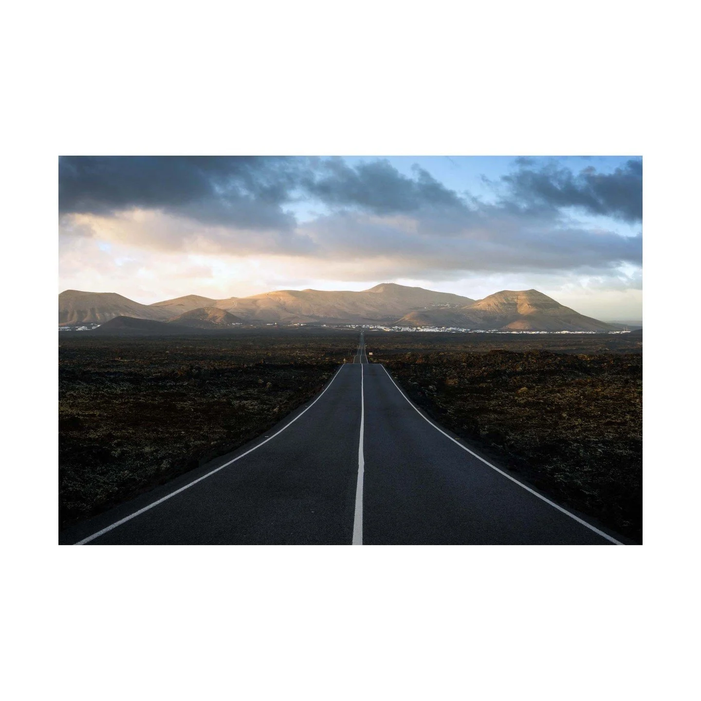 🚴&zwj;♂️ The Road to Yaiza 🚴&zwj;♂️
Heading down the open road to Yaiza, there&rsquo;s nothing quite like the contrast of white villages against the black volcanic earth, all under the soft glow of the rising sun. The wind rushes through your hair 