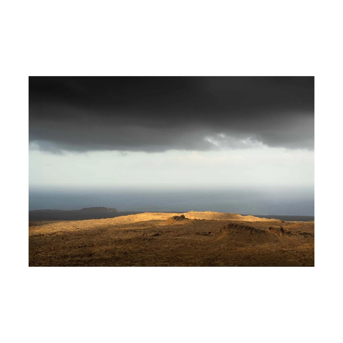 🌍 A Sliver of Light, A Moment in Time 🌍
In this fleeting moment, a sliver of light breaks through the clouds, illuminating the volcanic landscape. Captured in just 1/500th of a second, this moment is nothing compared to the eons it took to shape Ti