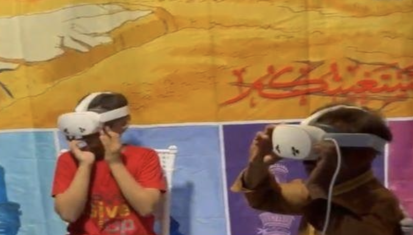 Participants using VR Headsets to get the immersive experience of watching events of Baqee