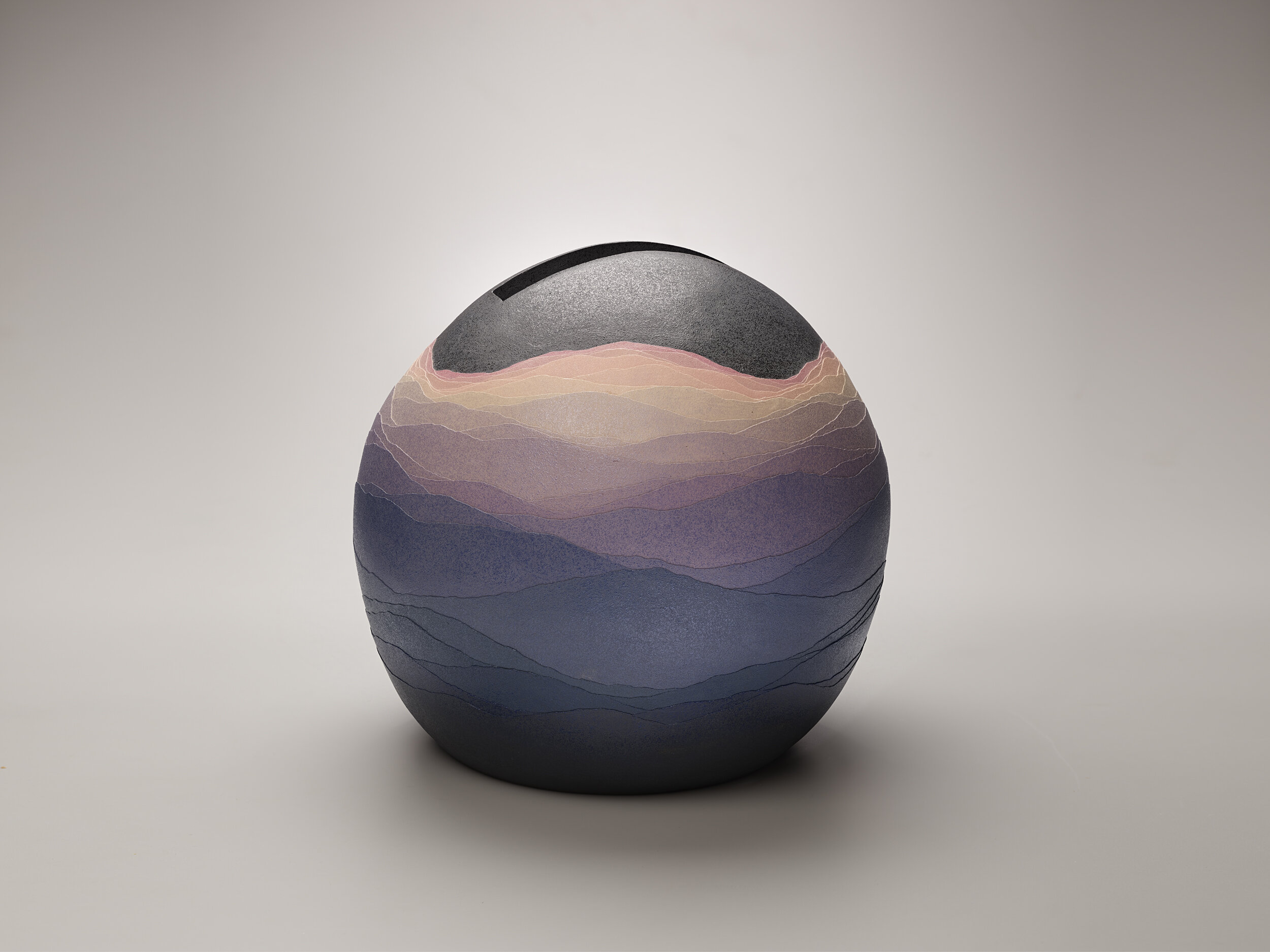  Miyashita Zenji (Japanese, 1939-2012), Enkū (Spherical Void), 1999, stoneware with appliquéd bands of saidei (“colored clay”: thin, dyed layers of clay), 14 3/4 in x 15 5/8 in x 16 in, Museum Purchase: Funds provided by Richard Kroll. Portland Art M