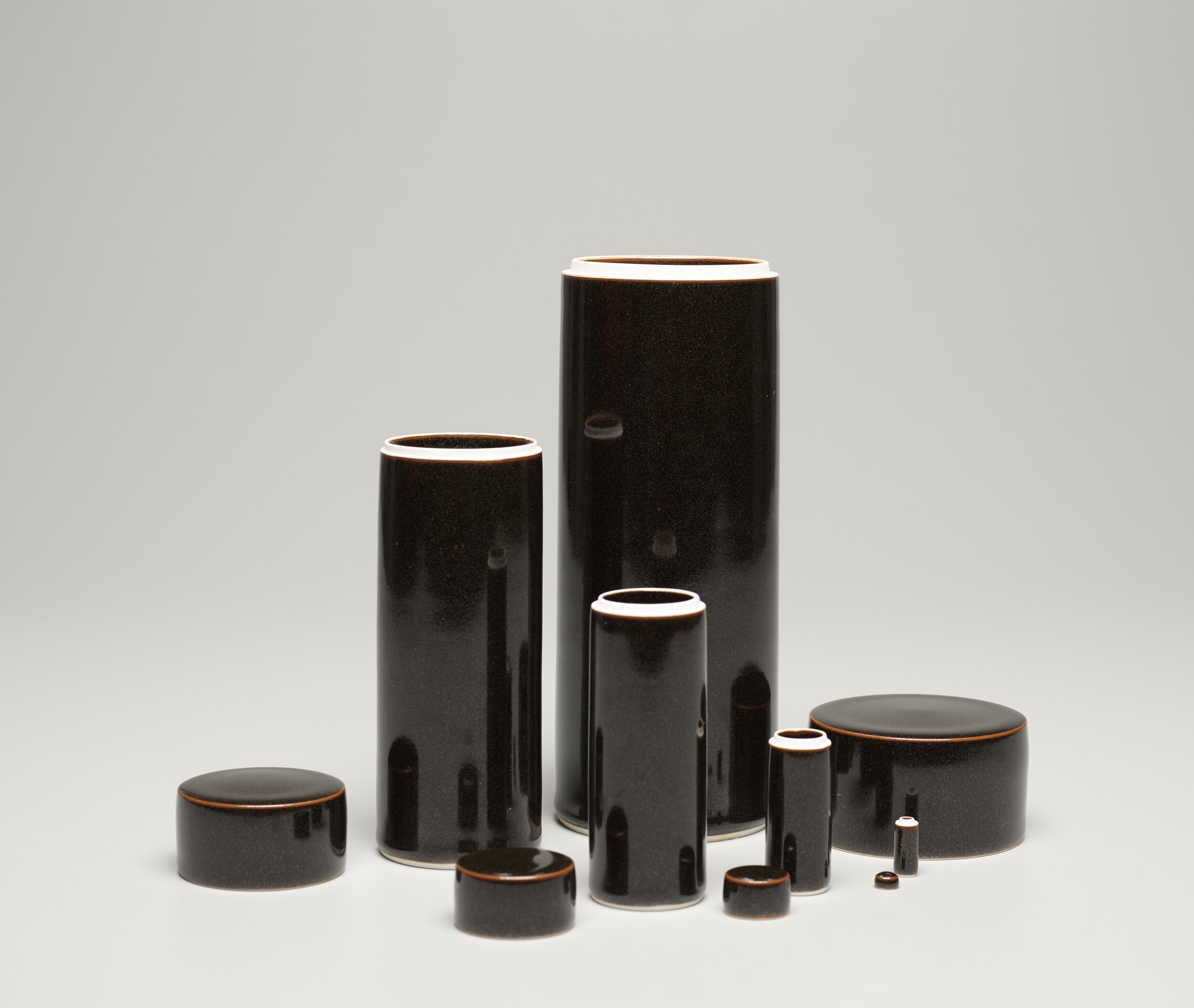  Yagi Akira, Five Cylindrical Nesting Boxes, 2004, porcelain with black glaze, Gift of Halsey and Alice North in honor of Yagi Sakiyo, © unknown, research required, 2018.27.1a-e 