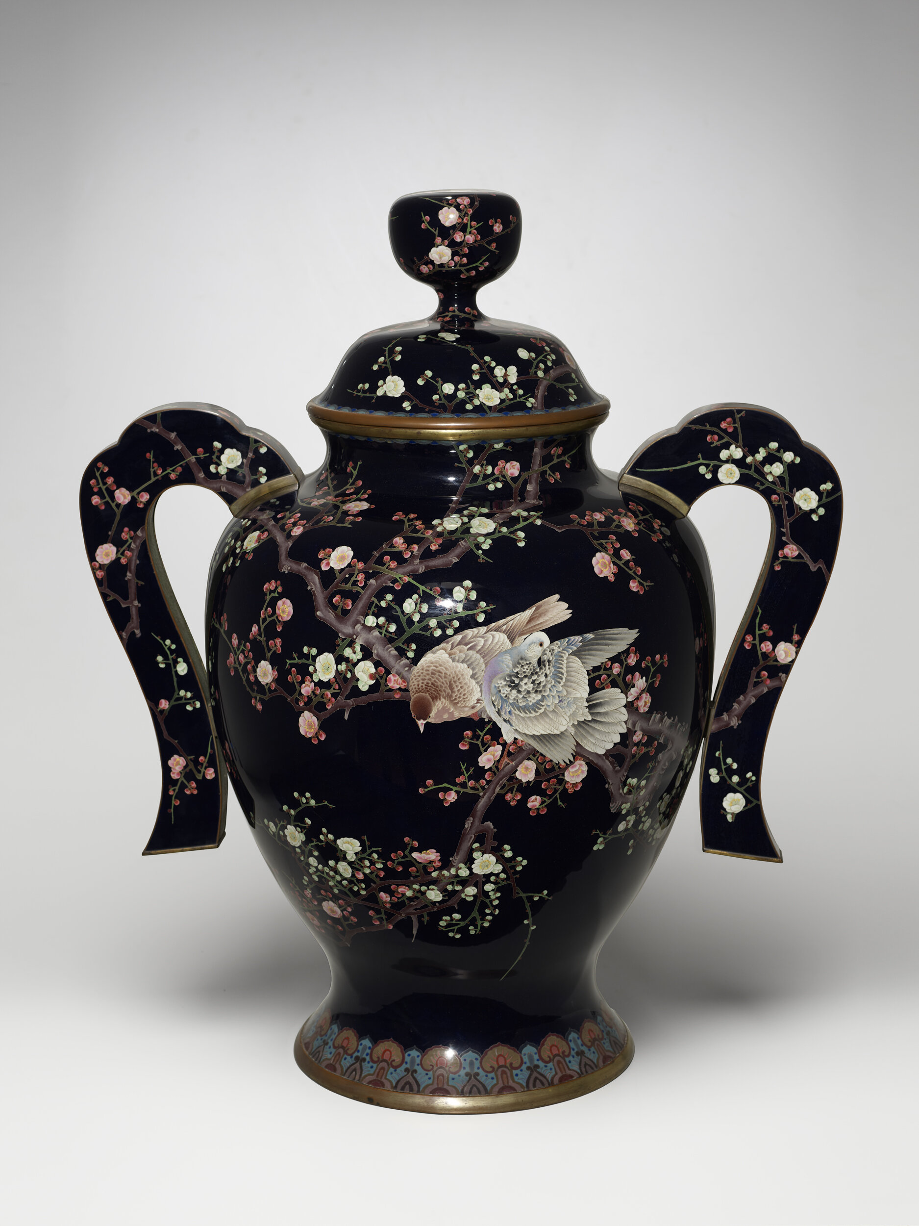  Japan, unknown artist (Japanese), Cloisonné urn with birds and plum blossom design, ca. 1895/1905, Cloisonné enamel with copper, brass, and silver, display: 35 1/2 in x 30 3/8 in x 21 5/16 in, Gift of Renee Pezzi. Portland Art Museum, Portland, Oreg