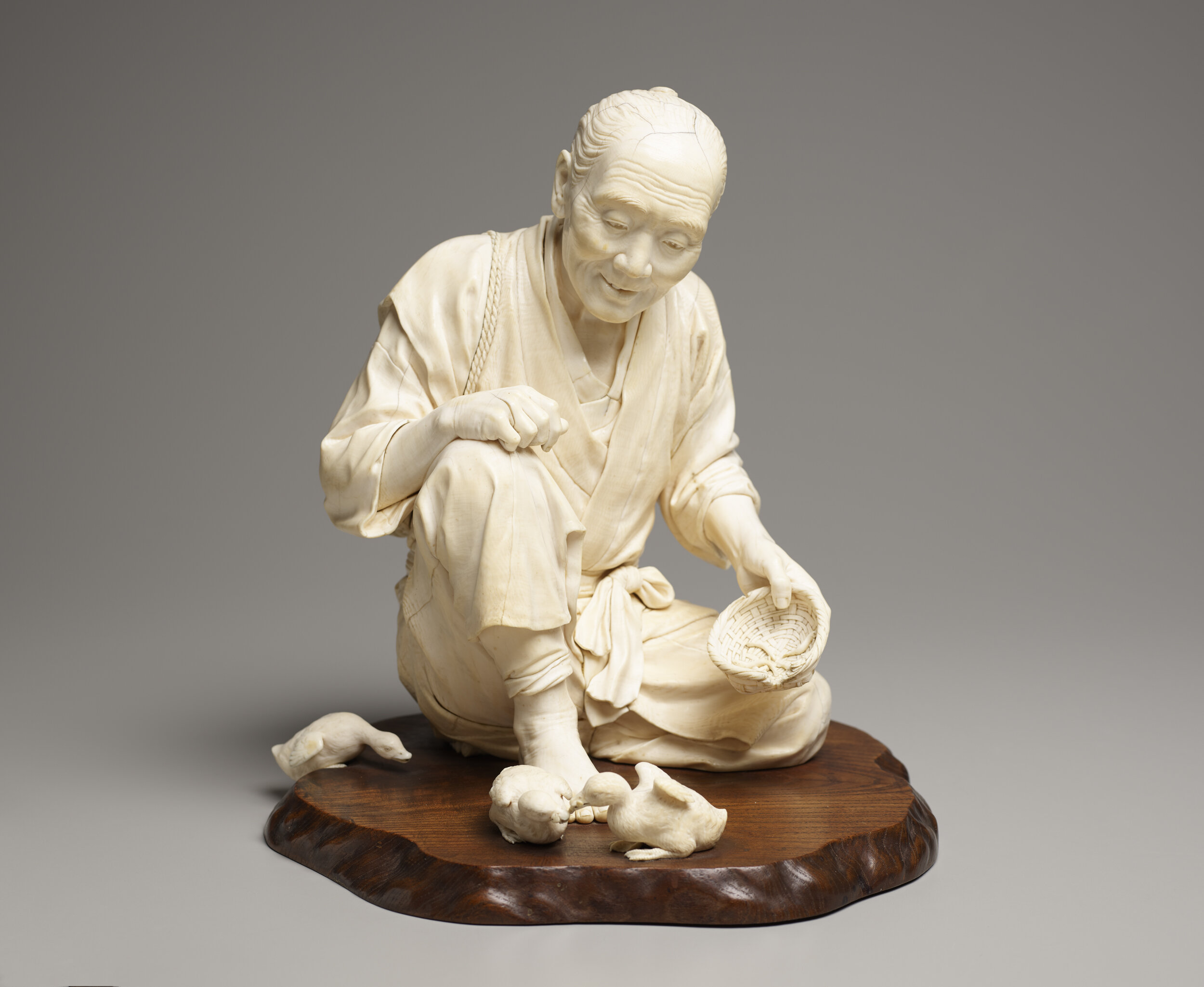  Hamada Masaaki (Japanese, 1898-1922), Old Man Feeding Ducks, late 19th century, ivory, 12 5/8 in x 12 5/8 in x 12 3/8 in, Gift of Rheba Turner from the Jerry Porsche Estate in memory of William D. WIlcox. Portland Art Museum, Portland, Oregon, 87.24