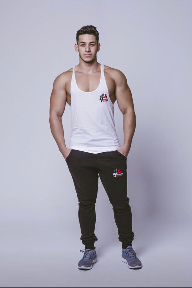 Front view of model wearing White Zane New Logo Vest with First Step Motivation logo