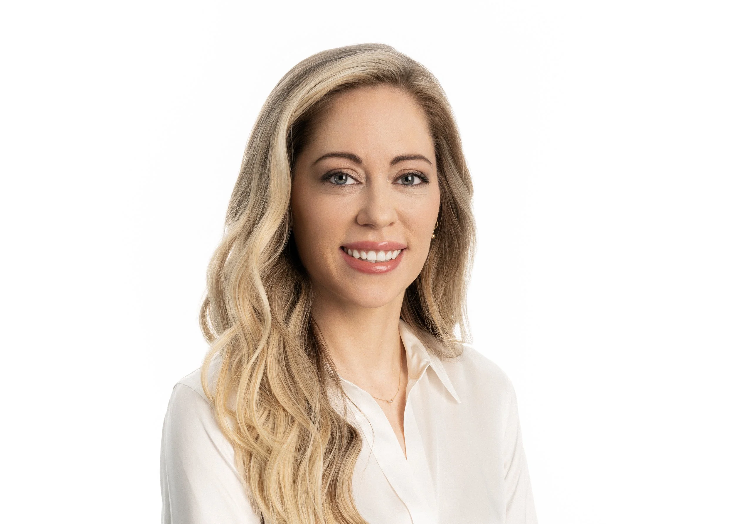 Headshot of Dr. Lindsay Eminger - woman with long blond hair and white shirt
