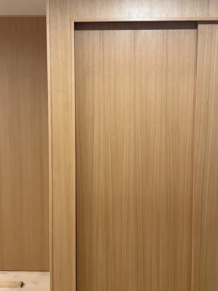 The directive for this home was to update for modern convenience and then thoughtfully bring back mid century modern details. These two closets were a perfect canvas for floor to ceiling wood panels and matching oak doors. In the bedroom, we pushed t