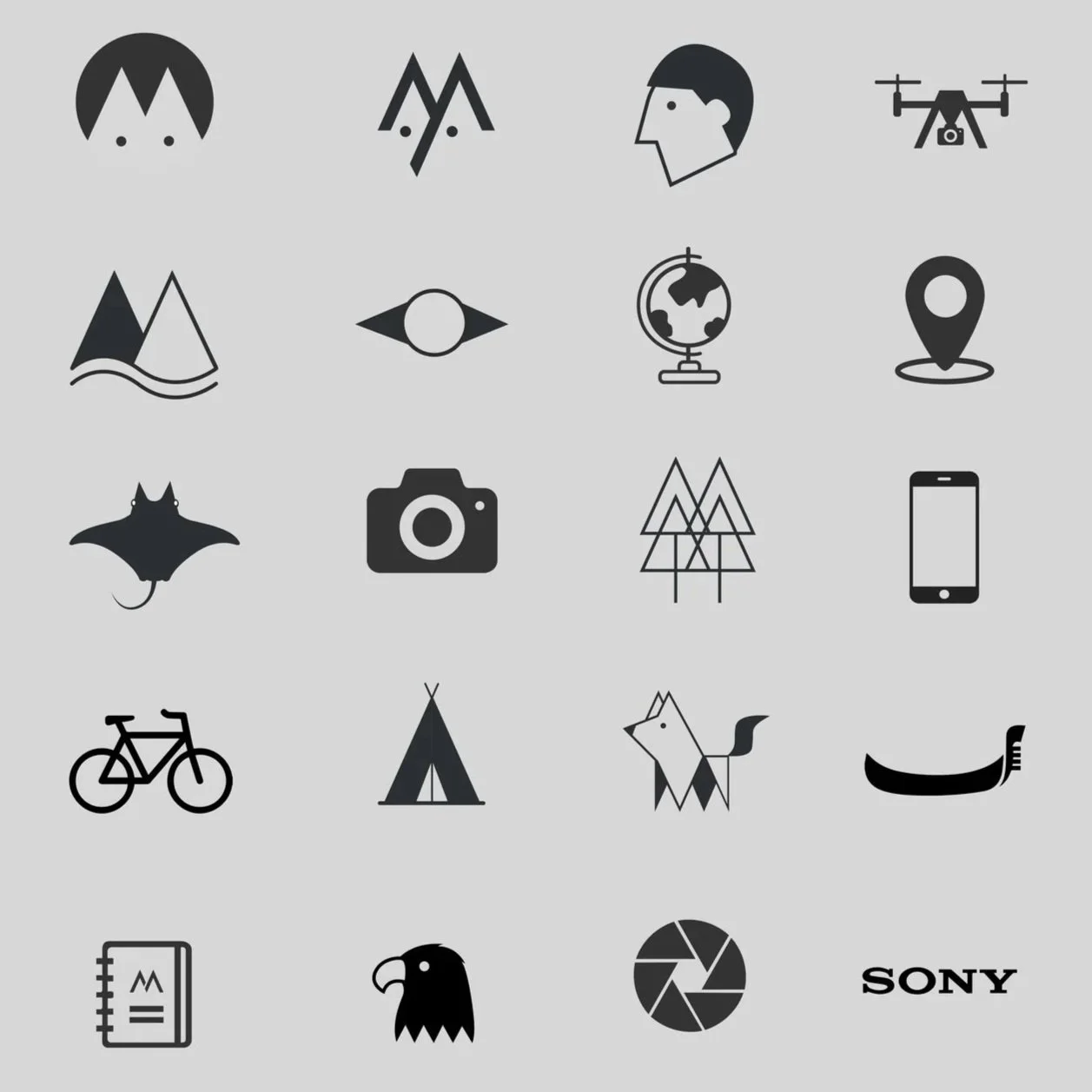 Collection of black minimalist icons on a gray background, including a face, mountain, globe, camera, bicycle, teepee, eagle, Sony logo, and a notebook.