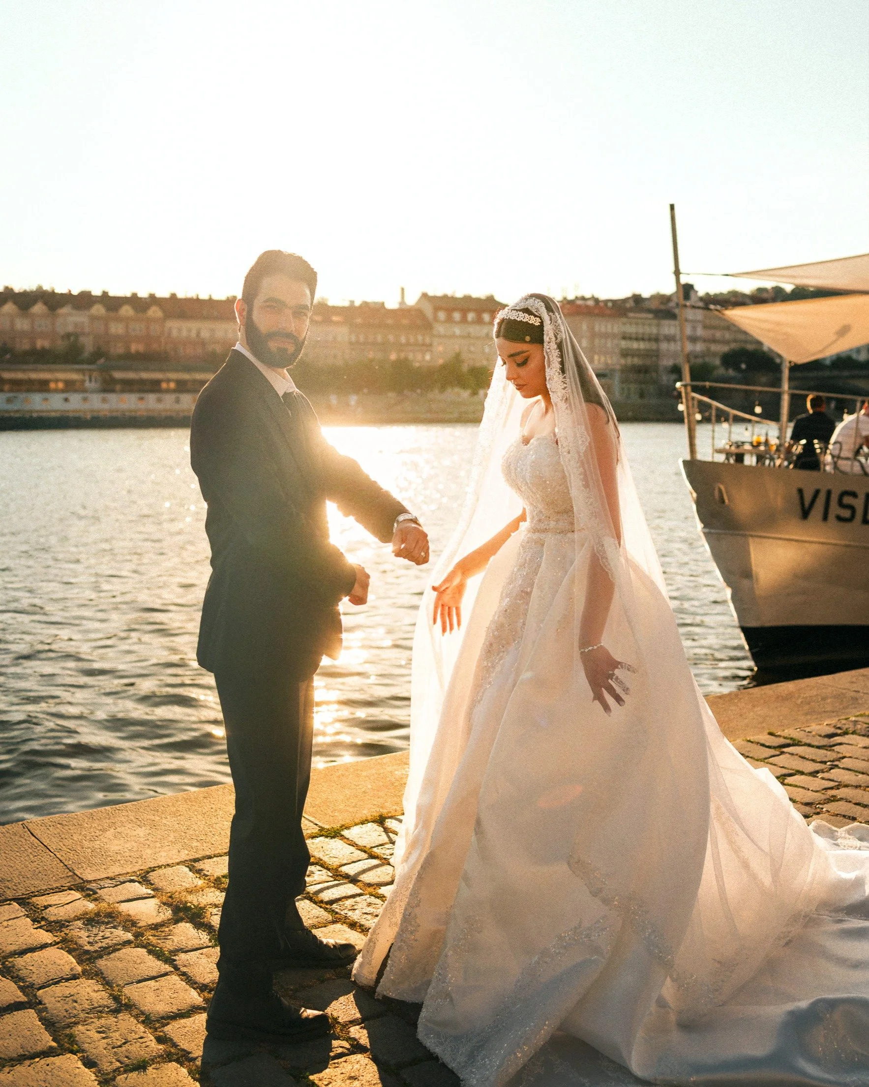 Summer pre-wedding for 💍L+A 📍Prague

We started our session by the sunlit Vltava, with golden light dancing across the river.

Usually, I'm the one visiting Dresden. This time though, they travelled to Prague, bringing their beautiful wedding dress